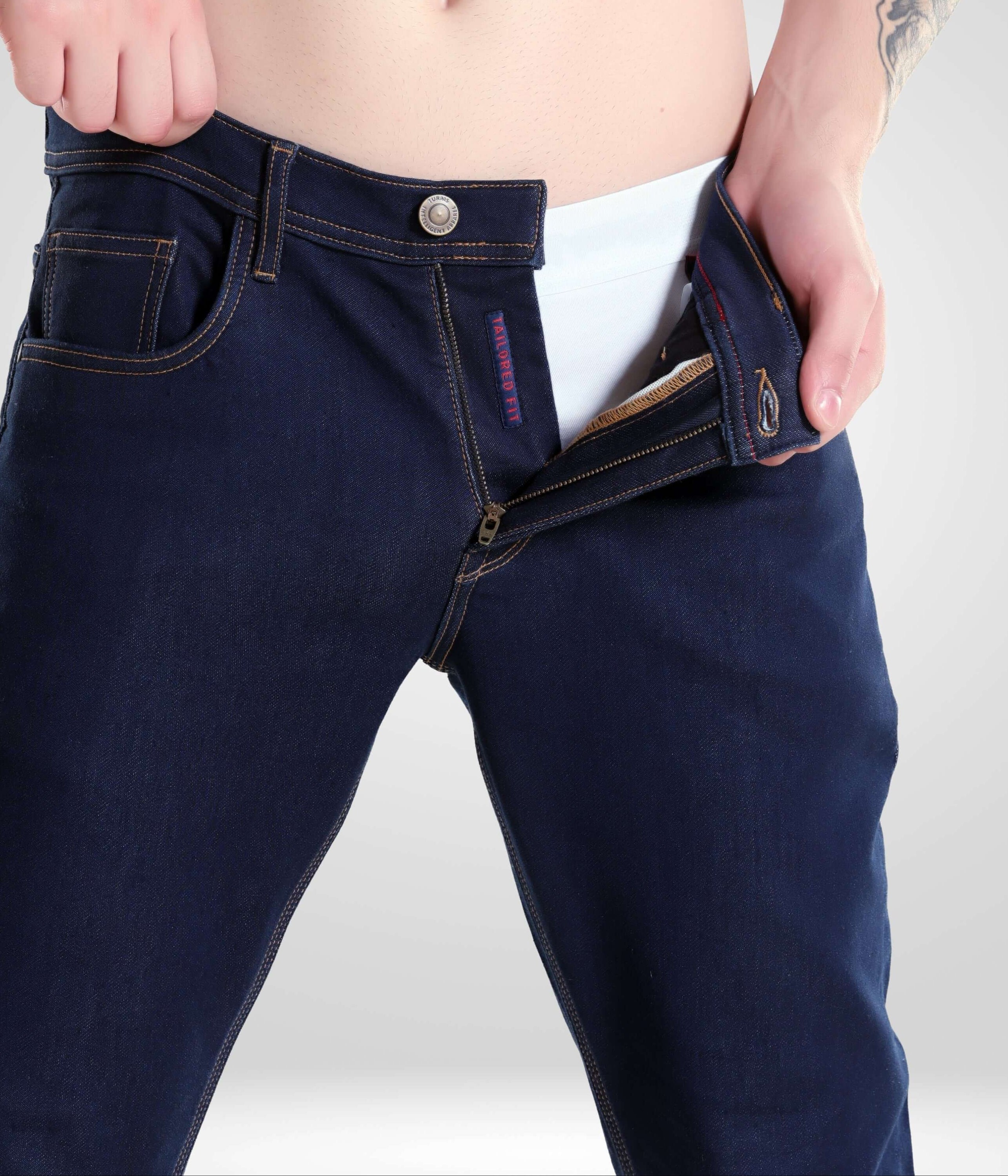 Man wearing Indigo Trotter high-performance denim pants by Turms Intelligent Apparel, showcasing premium men's fashion.