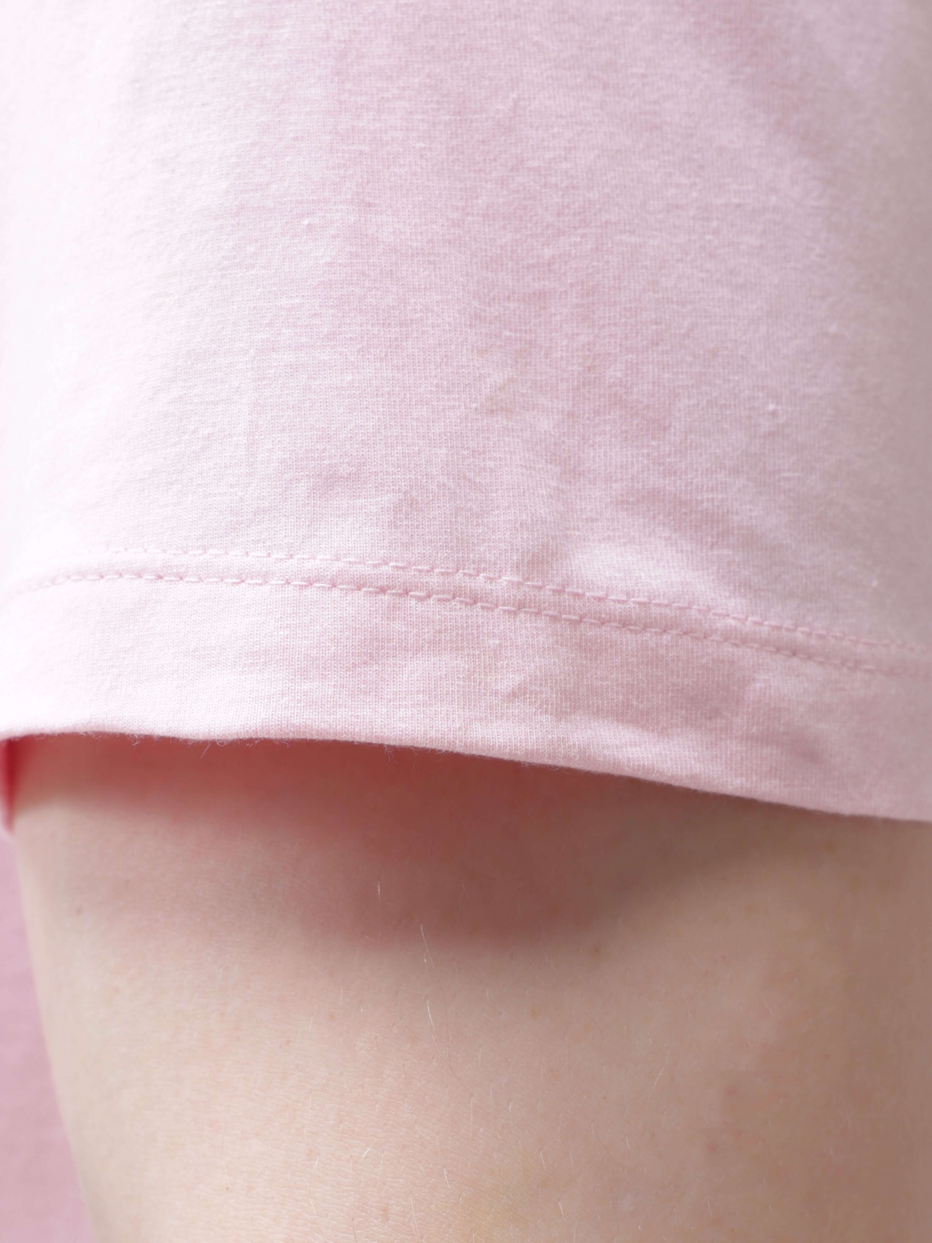 Close-up of the sleeve of a pink Mystic Orchid round-neck Turms T-shirt, showcasing premium cotton fabric and tailored fit.