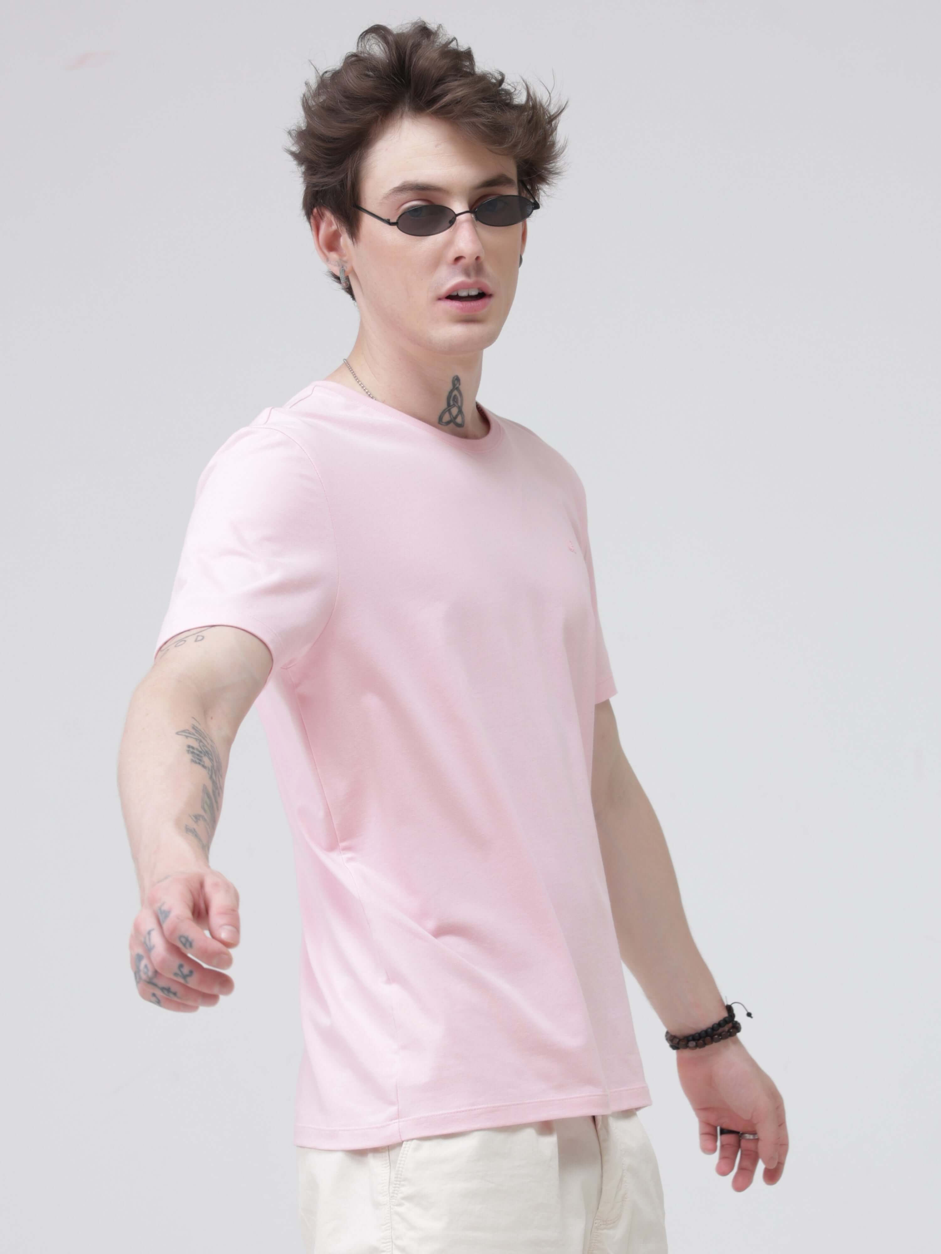 Man wearing a pink Turms Mystic Orchid T-shirt, tailored fit, anti-stain, anti-odour, stretchable intelligent apparel, trending best t-shirts.