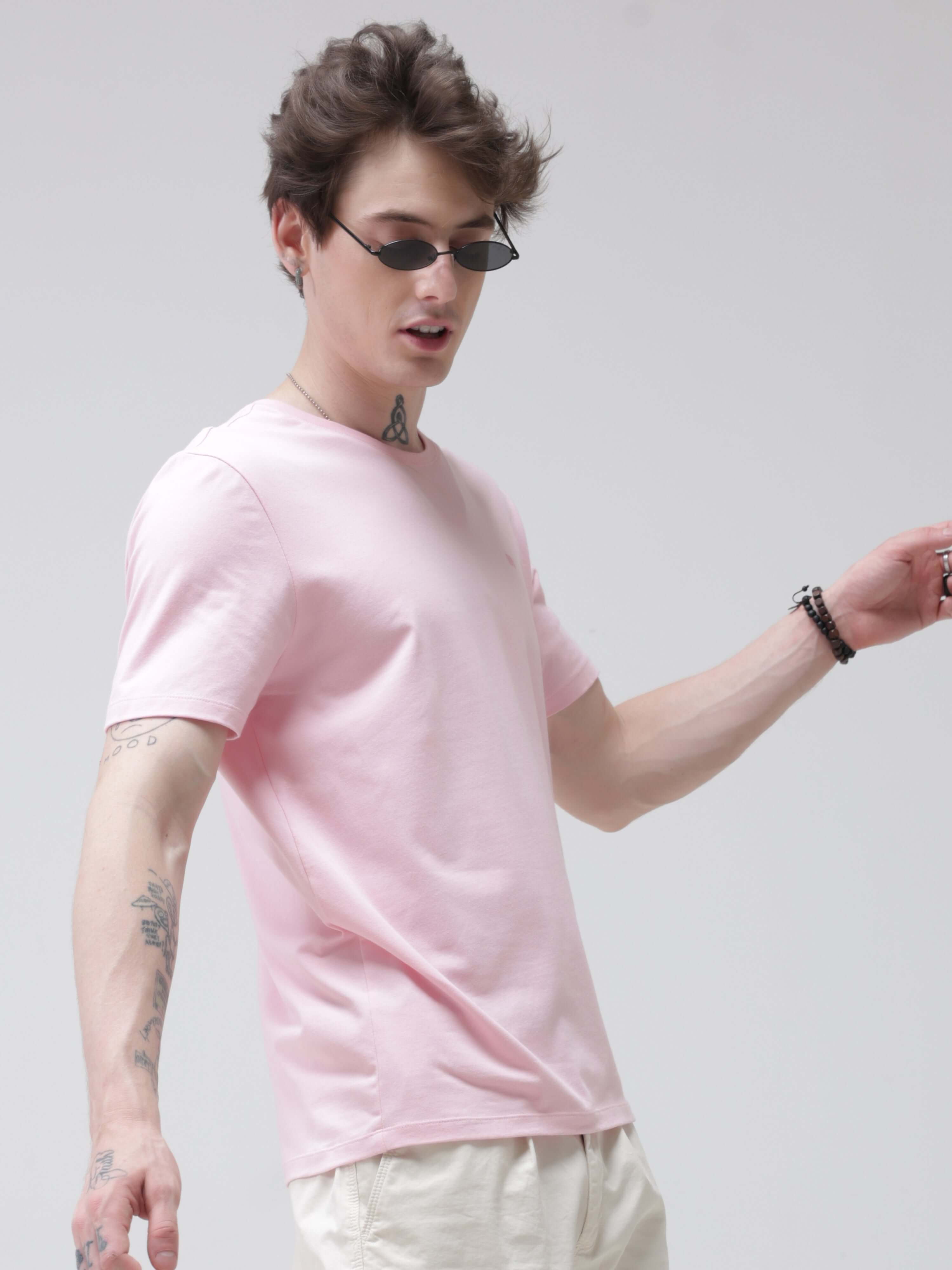 Man wearing pink round-neck Turms T-shirt with anti-stain, anti-odour, and stretchable fabric. Perfect intelligent apparel for trending best tshirts.
