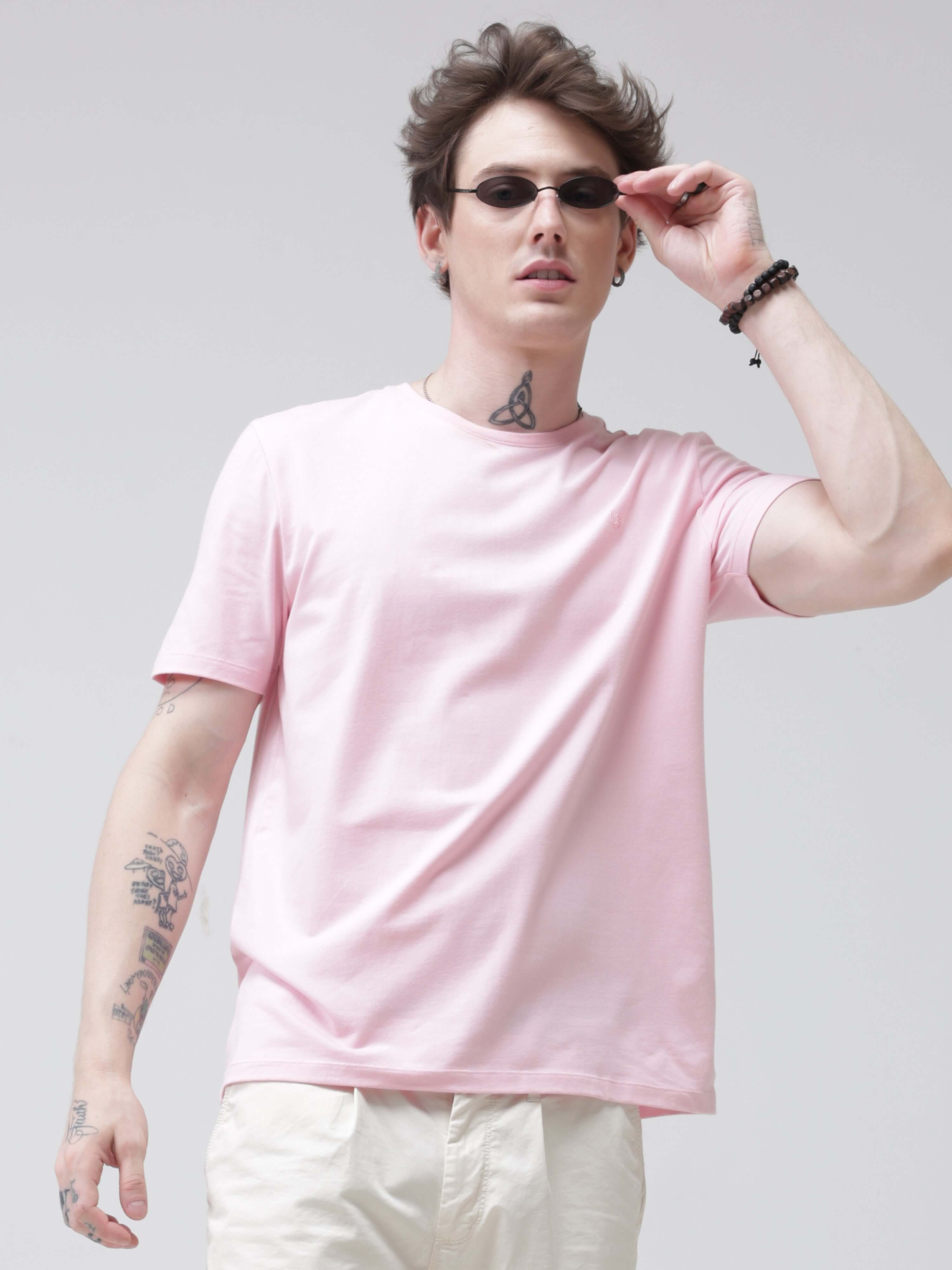 Man wearing a pink round-neck Mystical Orchid Turms T-shirt, anti-stain, anti-odour, and stretchable, showcasing intelligent trending apparel.