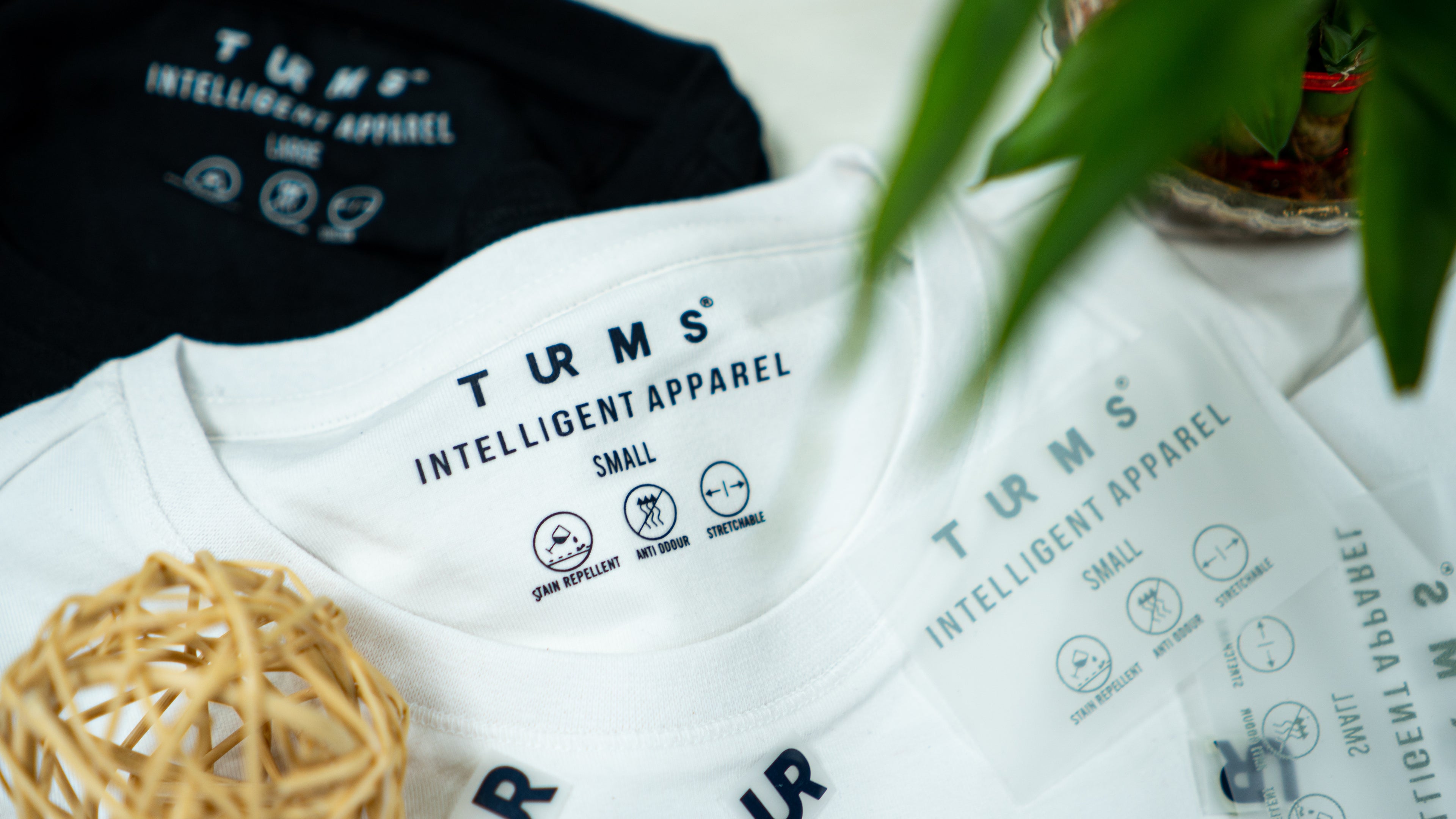 TURMS Intelligent Apparel labels on t-shirts showcase best in menswear technology for modern style.