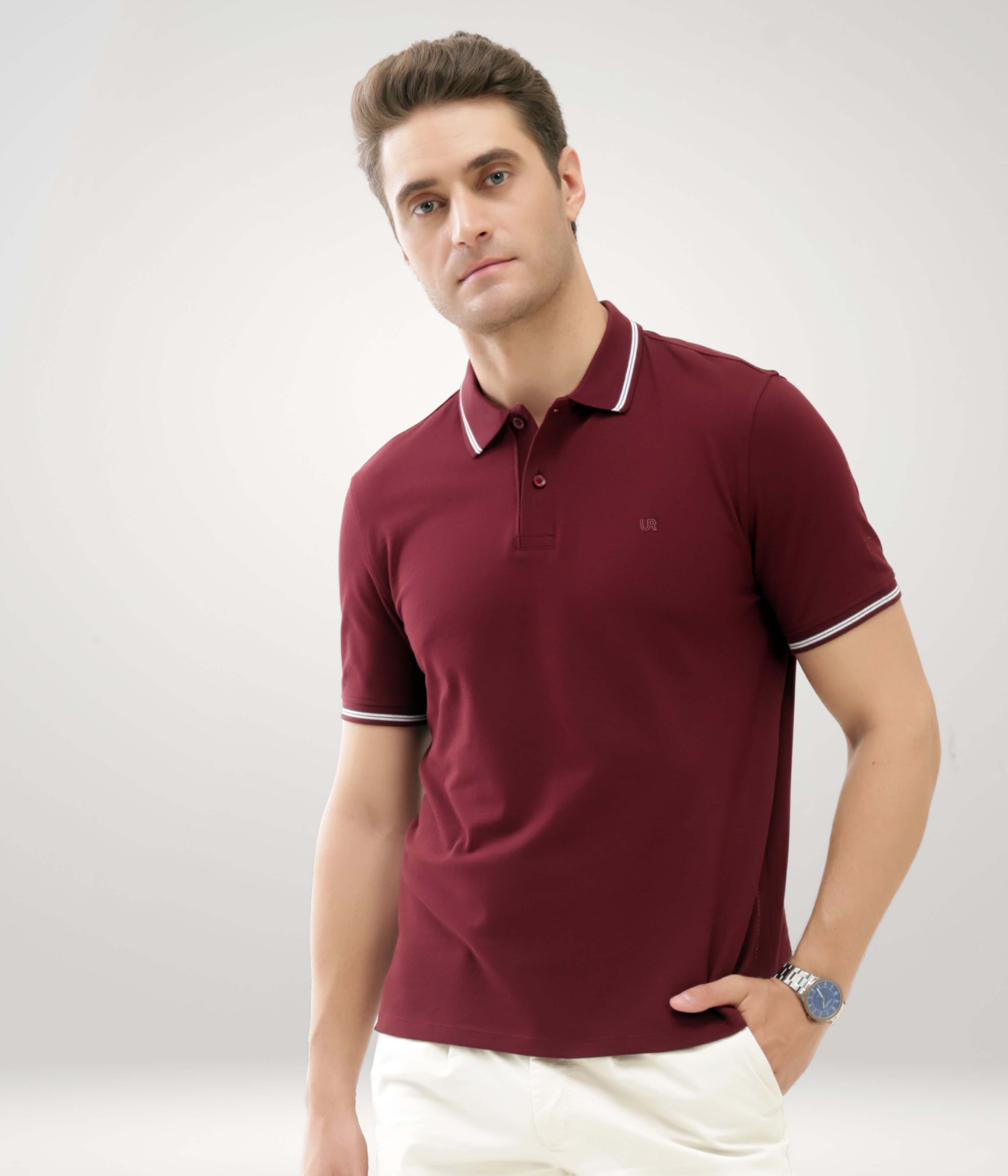 Man wearing wine-colored Turms Polo T-shirt made of premium cotton and lycra, featuring anti-stain, anti-odor, and anti-microbial properties.