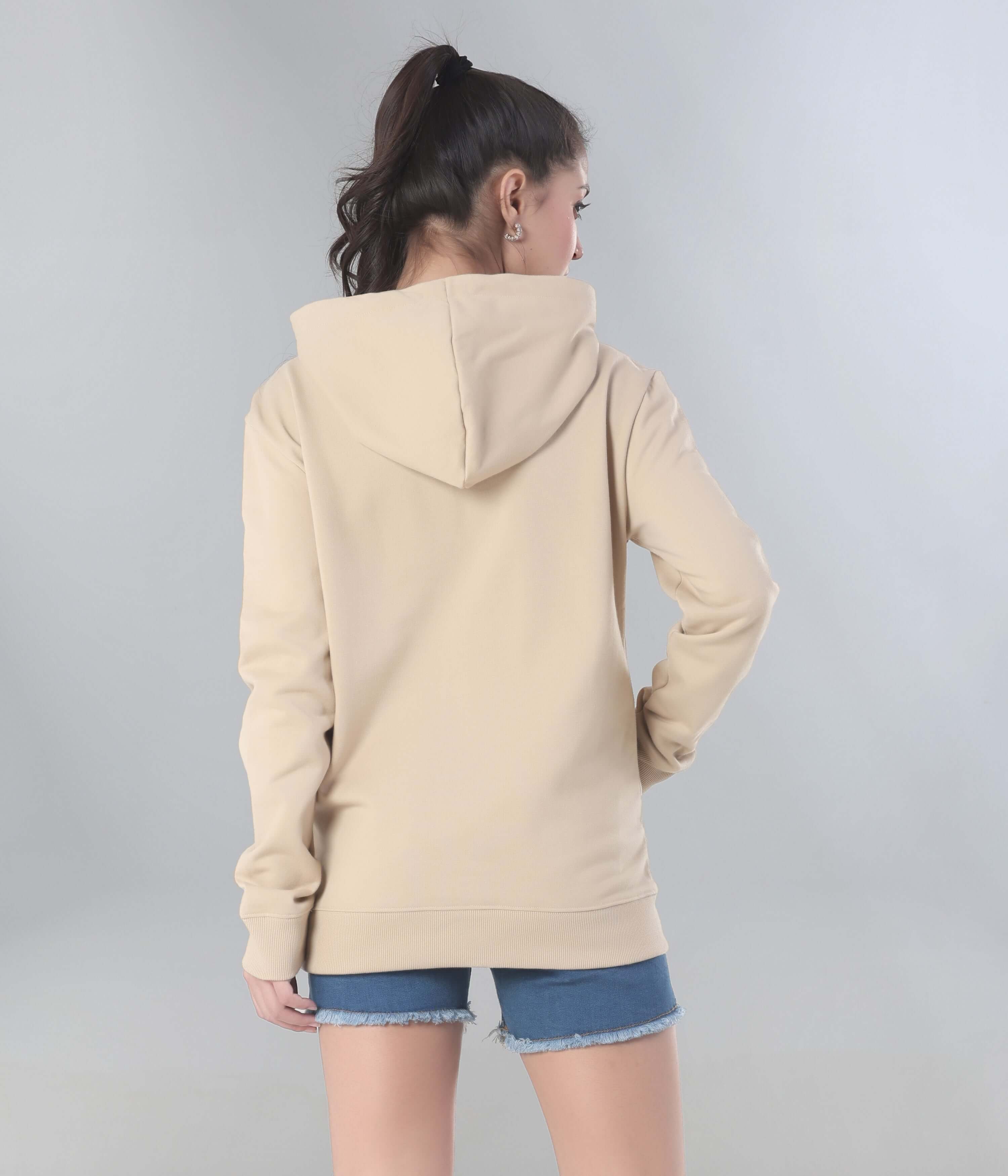 Back view of a woman wearing a beige Turms intelligent hooded sweatshirt, showcasing its stylish and comfortable design.