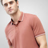 Man wearing Luxe Cocoa Turms Polo T-shirt made of premium cotton with tailored fit and anti-stain, anti-odor technology.