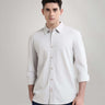 Man wearing Ashen Grey premium menswear knitted shirt, anti-stain, anti-odour, with long sleeves and button-up front.