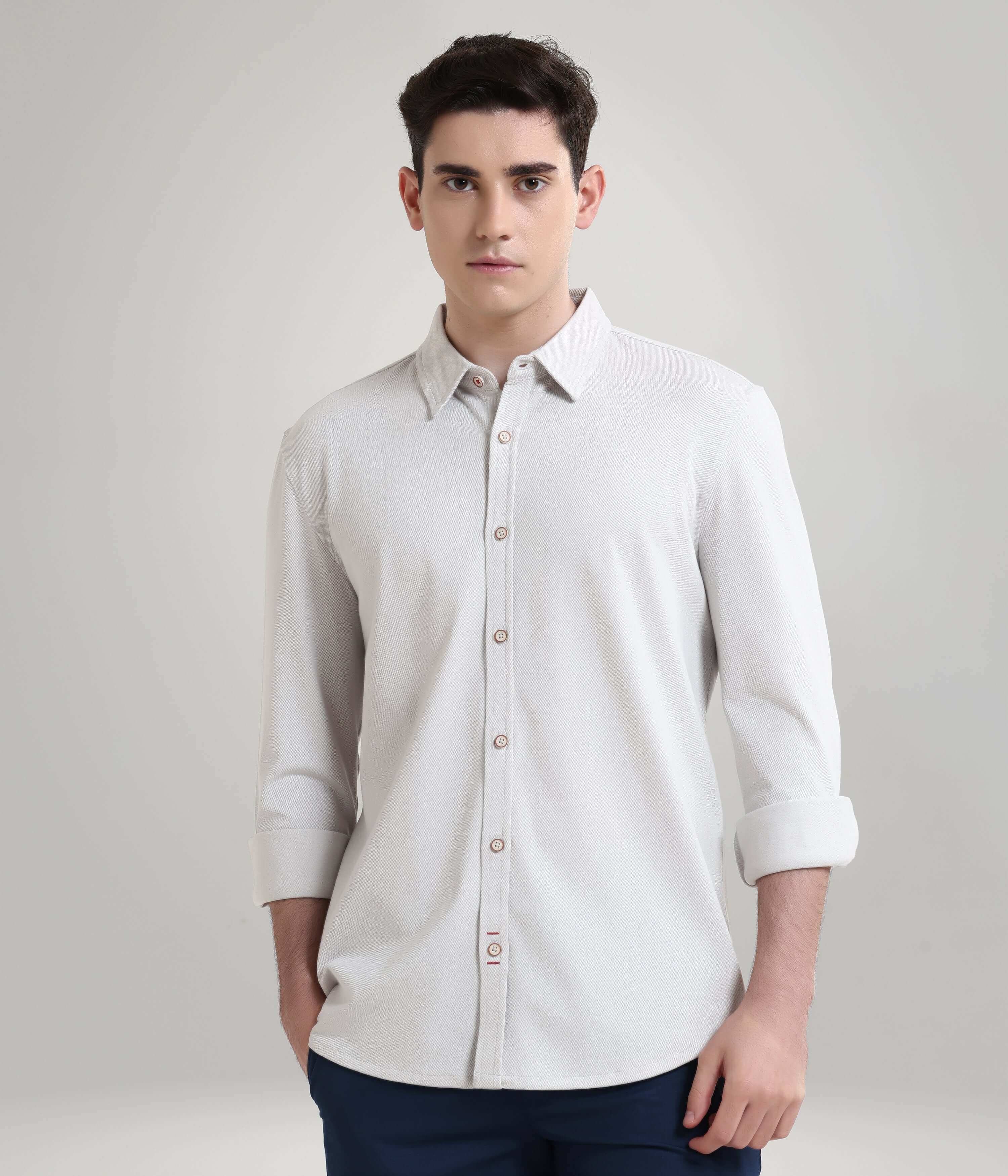 Man wearing Ashen Grey premium menswear knitted shirt, anti-stain, anti-odour, with long sleeves and button-up front.