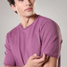 Man wearing Dusty Rose round-neck Turms T-shirt with CoolTech technology, made of premium cotton and Spandex blend for comfort and style.