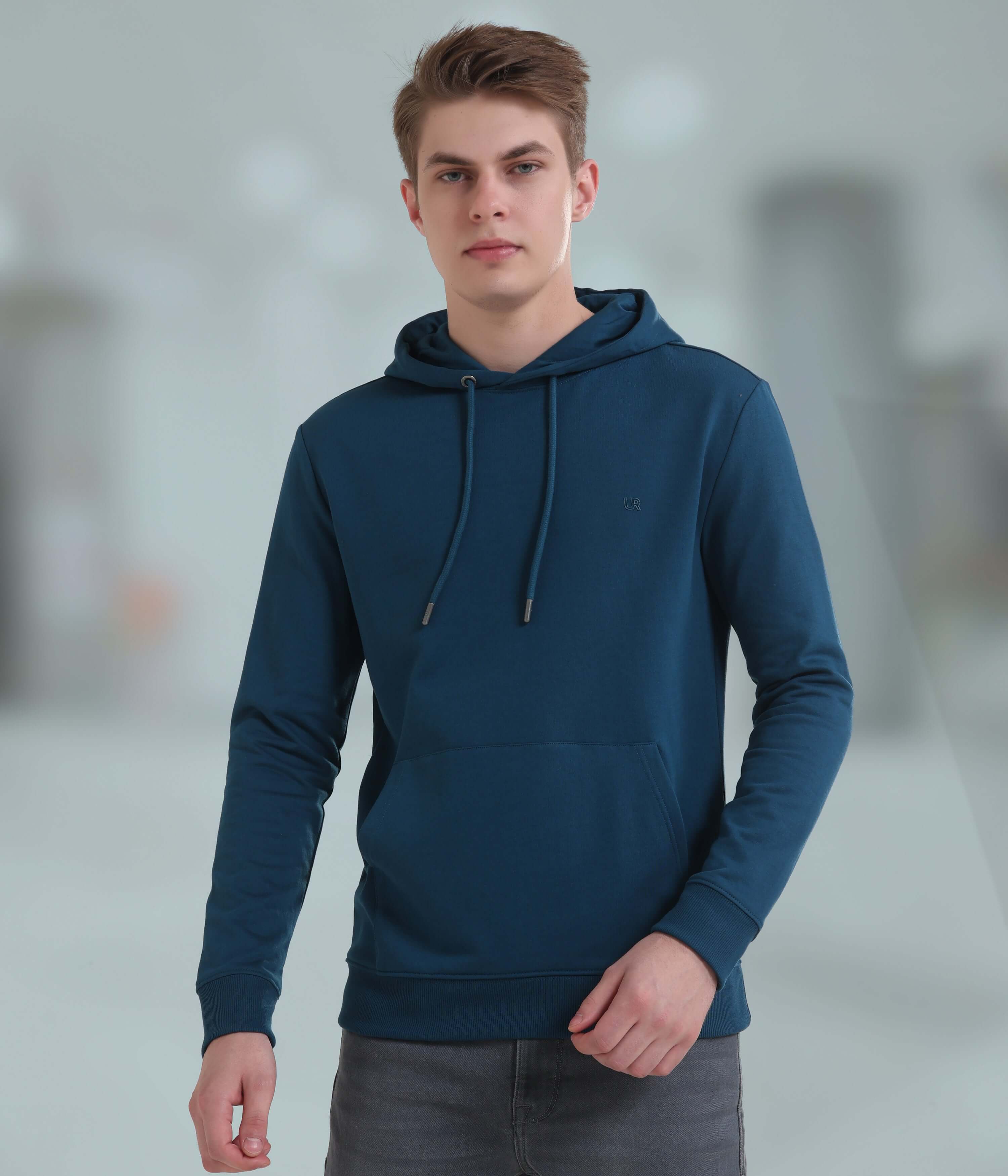 Stylish blue hooded sweatshirt for men, crafted from soft, breathable fabric; ideal for everyday comfort and sporty looks.