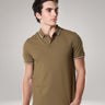 Man wearing Tranquil Green Turms Polo T shirt with tailored fit, anti-stain, anti-odor features, made from premium cotton and lycra.