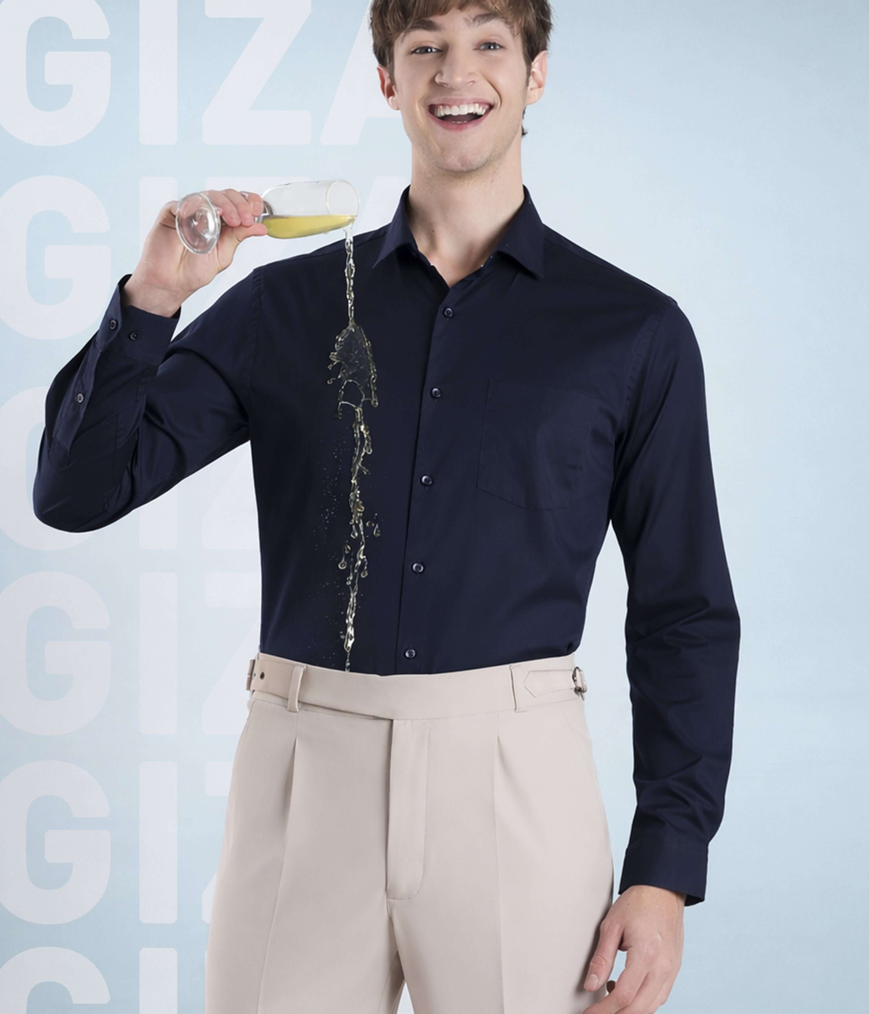 Man wearing Navy Eclipse shirt from Turms Intelligent Apparel, showcasing luxury and style with champagne.