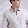 Model wearing a Pepple Haze Oxford Turms shirt in grey, showcasing premium quality and stylish design for men's intelligent apparel.