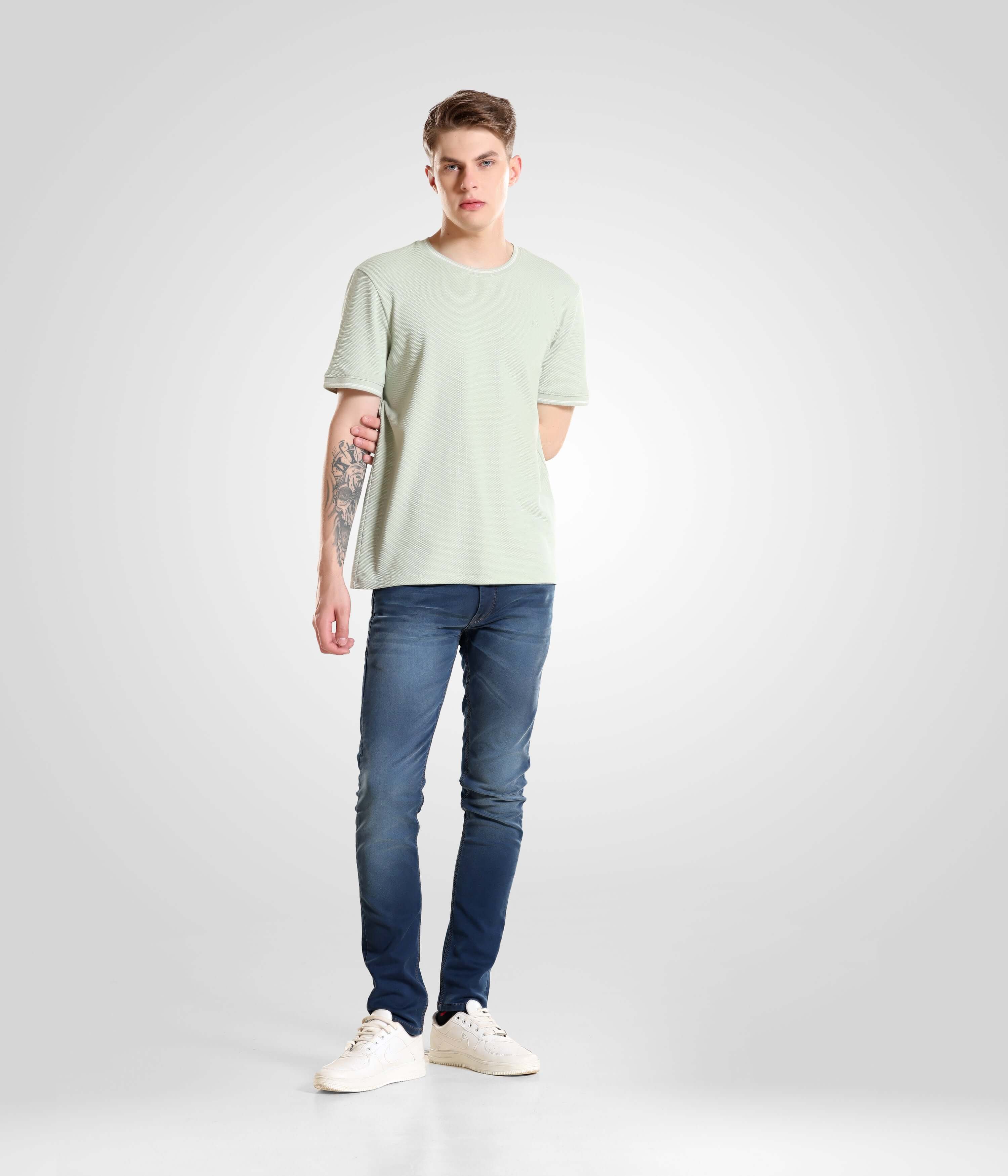 Man wearing Serene Light Green Turms T-shirt, tailored fit, crew neck, premium cotton, best menswear brand, intelligent apparel.