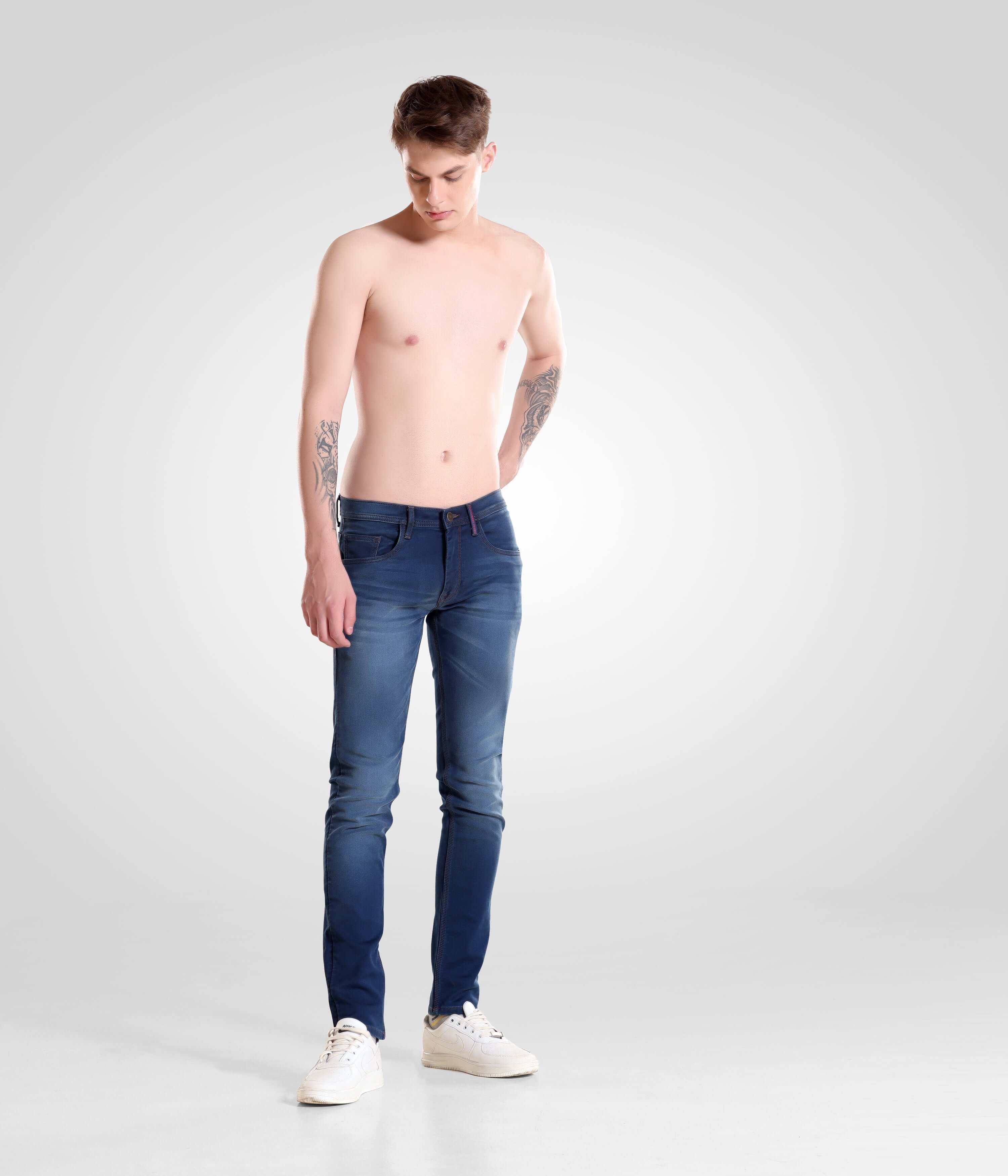 Shirtless man wearing Noir Blue Turms intelligent denim pants, menswear best brand, showcasing style, comfort, and high performance