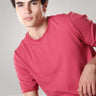 Man wearing Regal Pink Turms T-shirt made of premium cotton blend for cool and comfortable fit