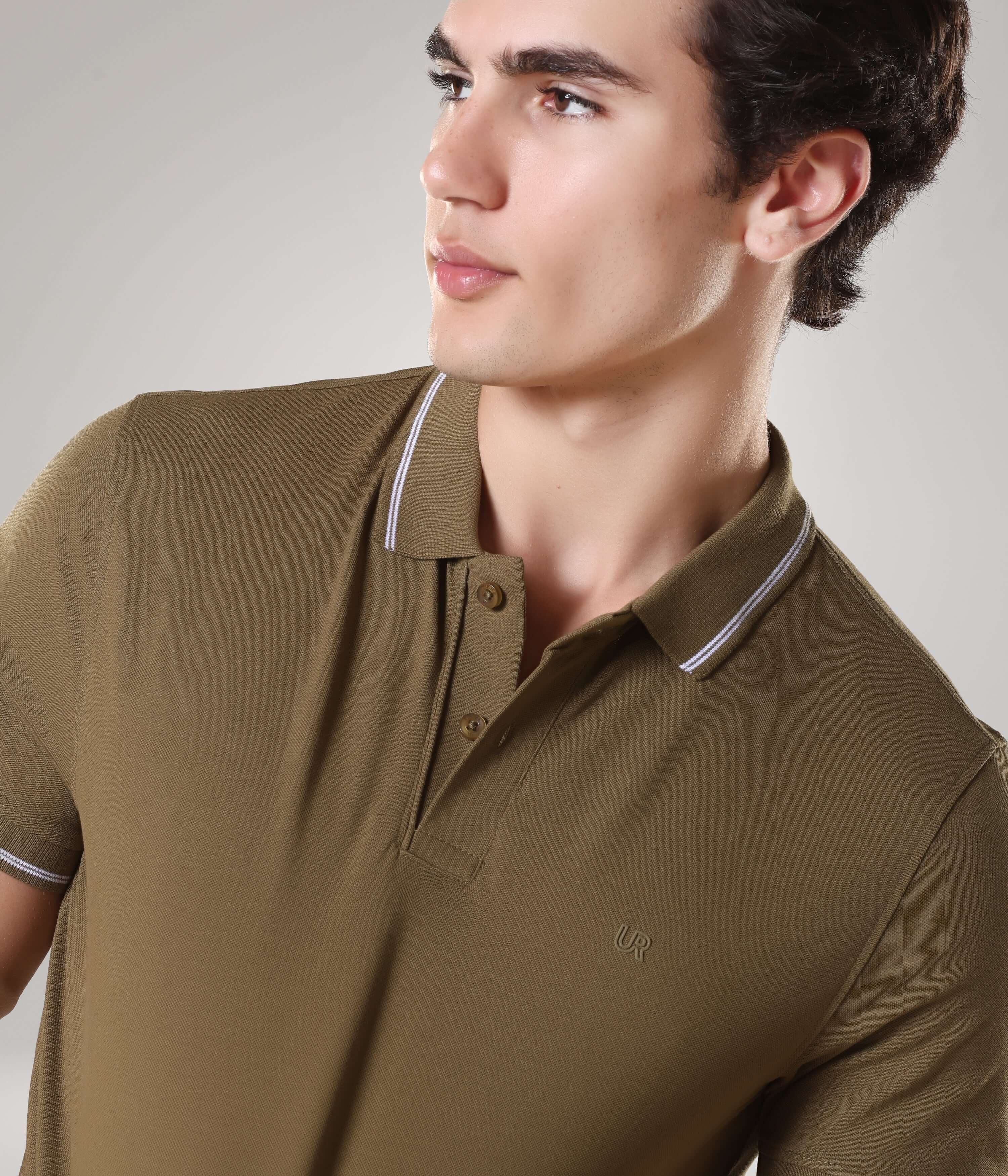 Man wearing Tranquil Green Turms Polo T-shirt, showcasing anti-stain, anti-odor properties with tailored fit and premium cotton-laden fabric.