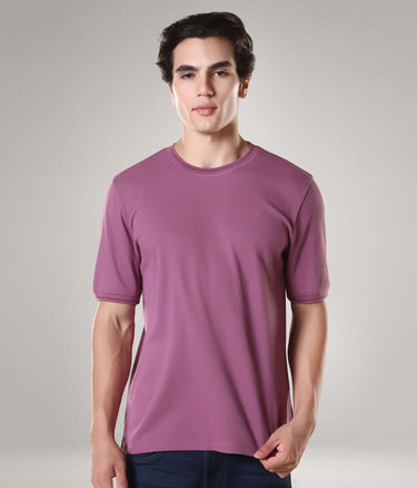 Man wearing Dusty Rose Turms T-shirt with CoolTech, made of premium cotton and spandex, tailored fit, anti-stain, and anti-odor technology.