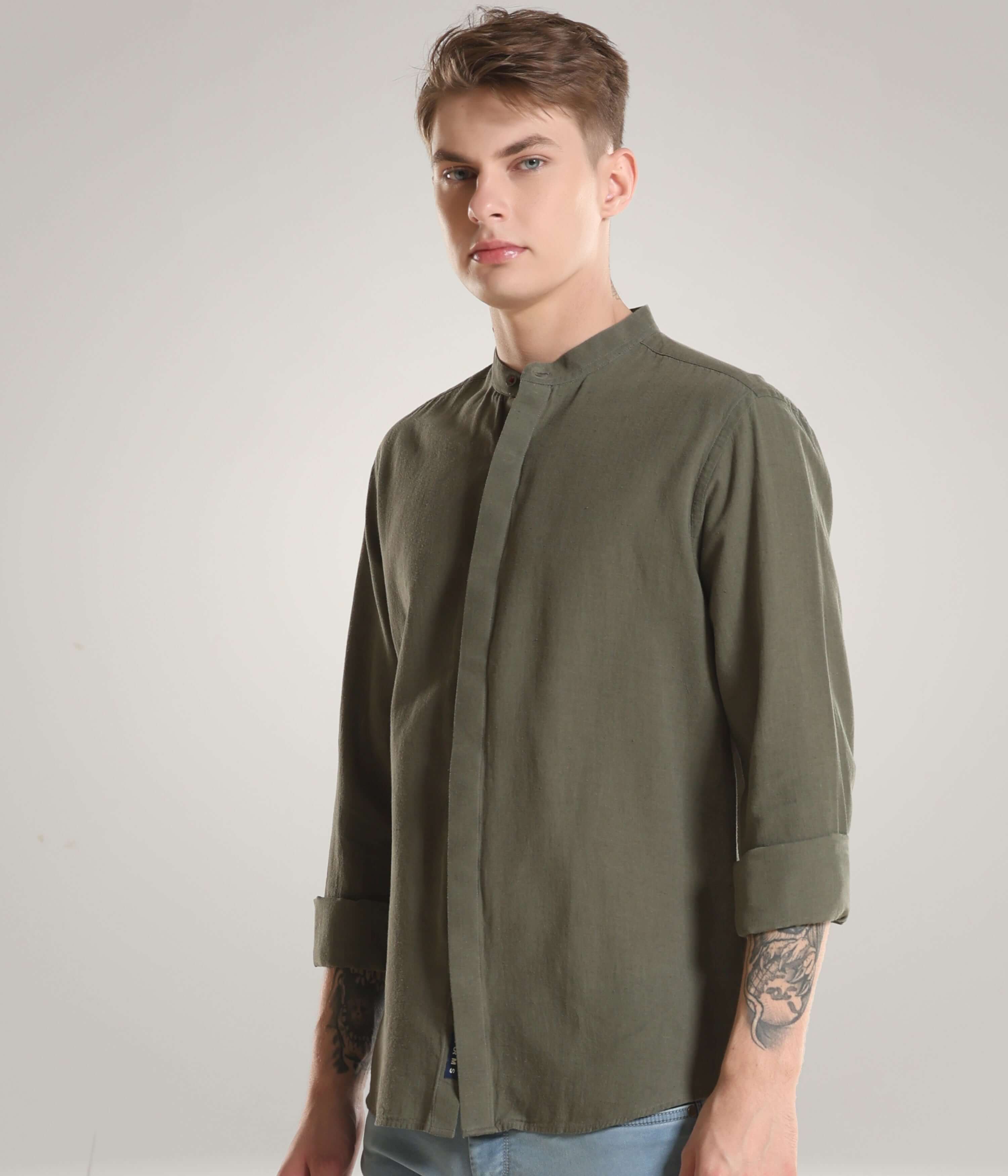 Man wearing Lichen Green Turms cotton/linen shirt with premium mandarin collar, showcasing durable and stylish everyday luxury apparel with CoolTech.