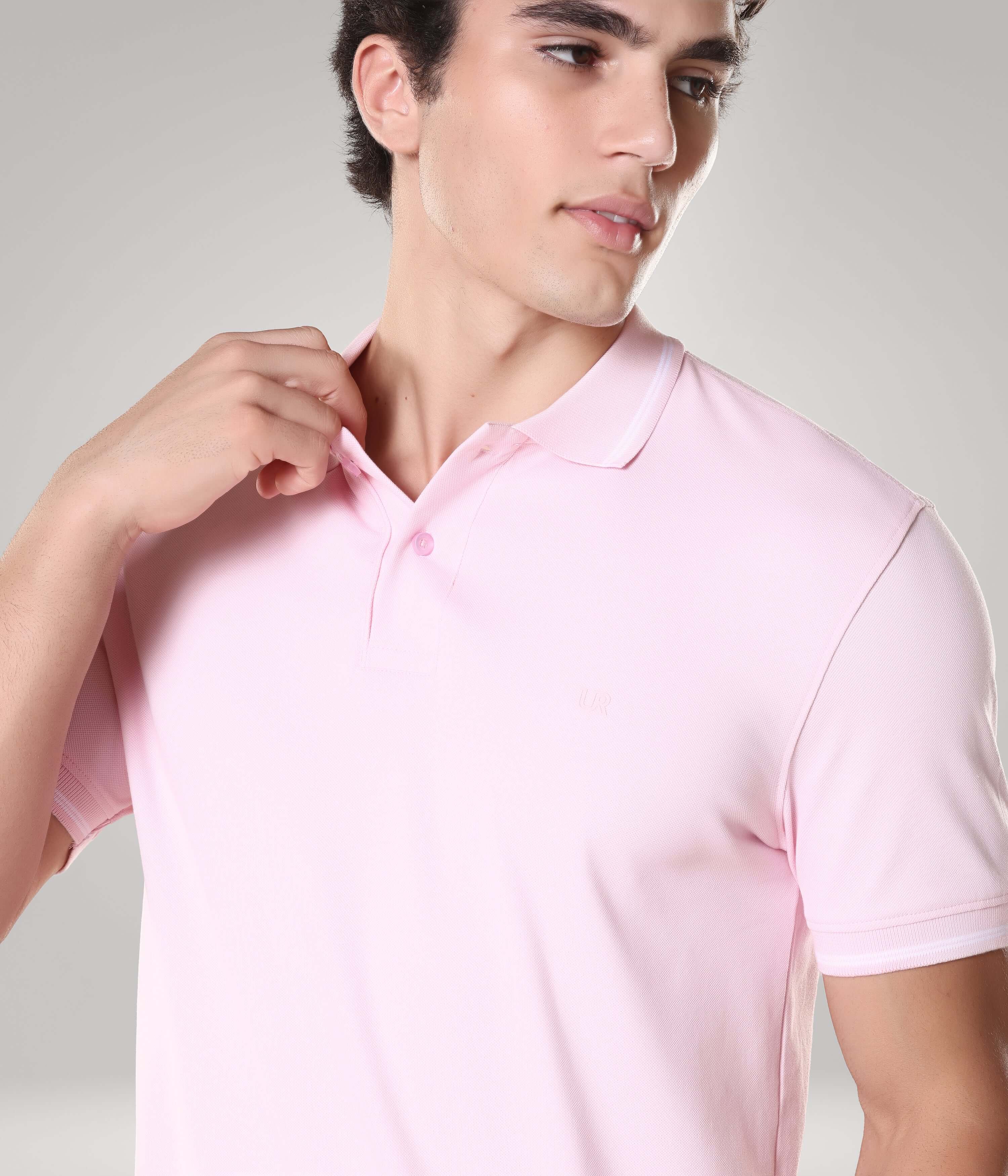 Man wearing light pink Turms Intelligent Apparel polo T-shirt made from premium cotton, featuring anti-stain and anti-odor properties.