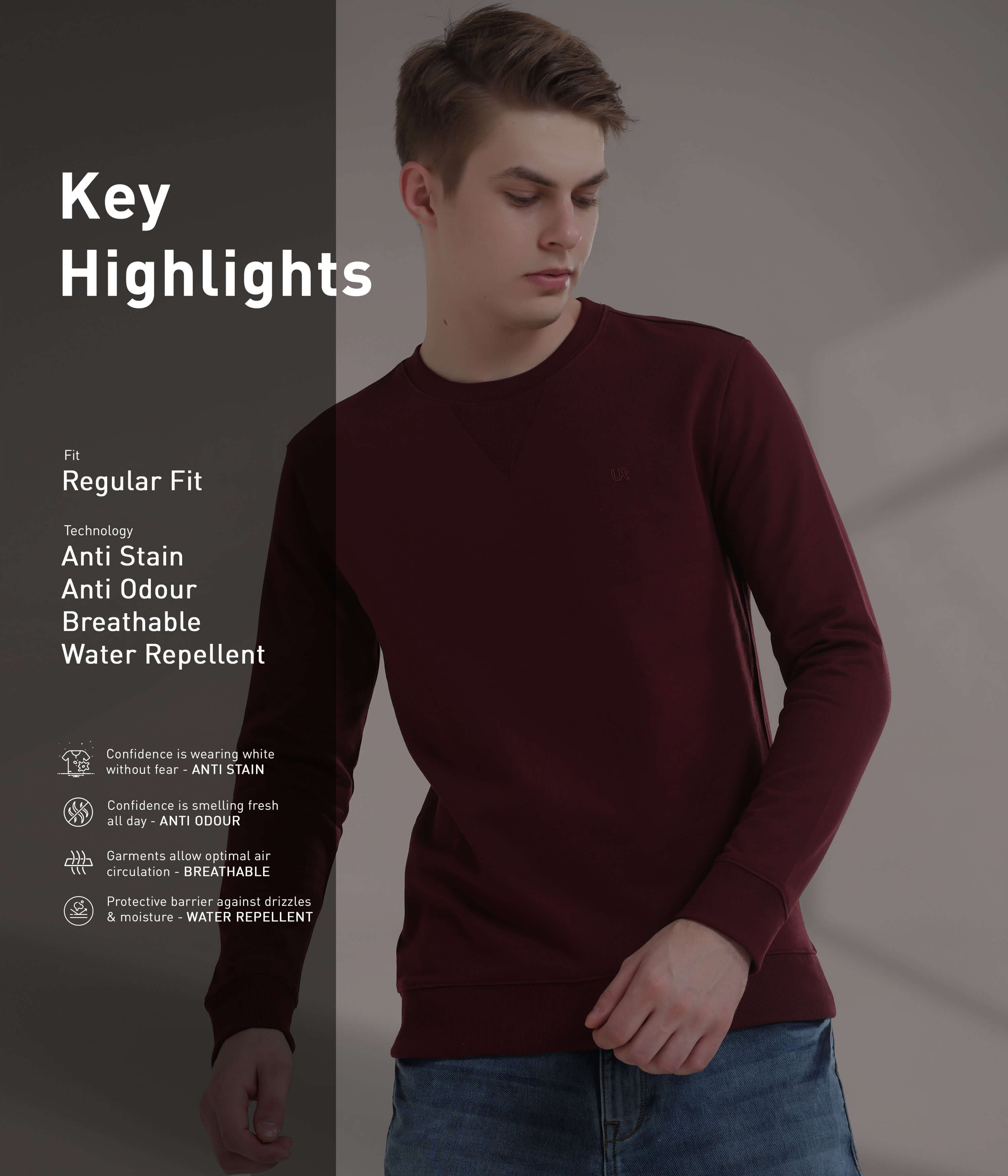 Model showcasing a burgundy sweatshirt featuring anti-stain, anti-odour, breathable, and water repellent technology.