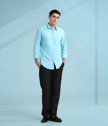 Model in turquoise Oxford Turms shirt showcasing intelligent apparel design, perfect for stylish and durable menswear.