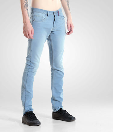 Light blue Quantum Blue denim pants from Turms Intelligent Apparel showcasing high-performance menswear fashion.
