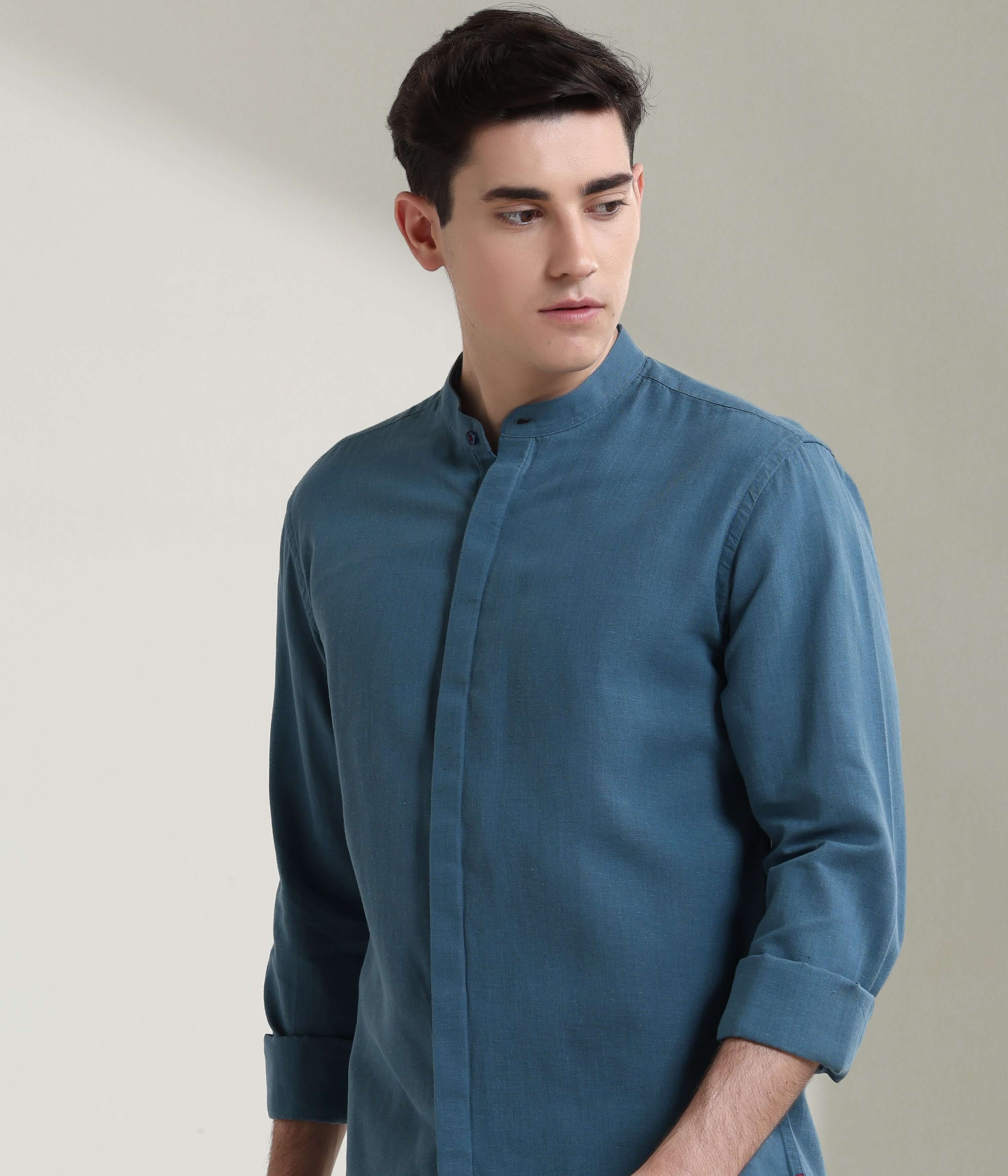 Man wearing Onyx Teal linen shirt with mandarin collar, designed with anti-stain and anti-odour intelligent apparel by Turms.