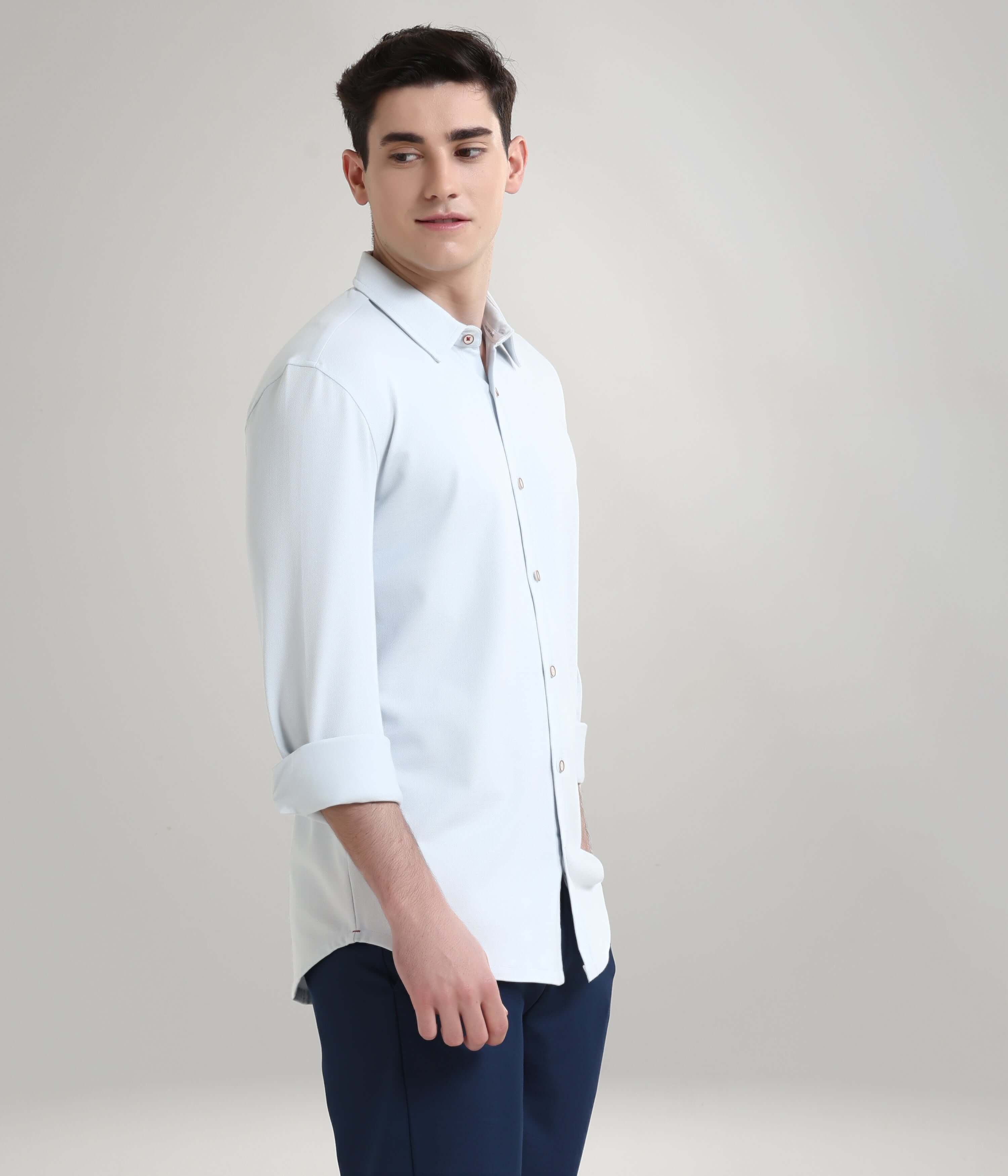 Man wearing Ethereal Blue Knitted Turms Stretchable Shirt, premium menswear with anti-stain and anti-odour features.