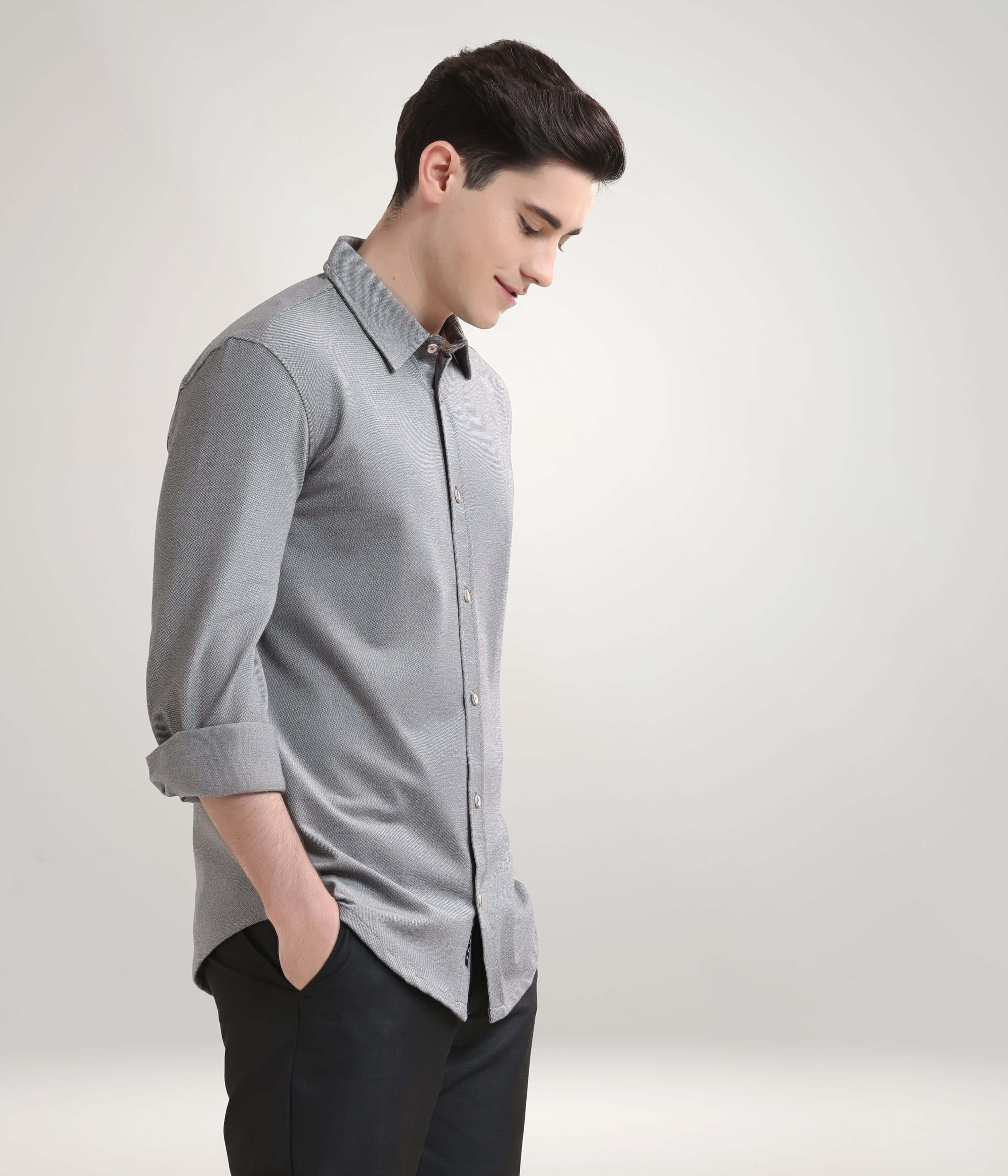 Man wearing Stormy Charcoal Knitted Turms Stretchable Shirt, premium menswear with anti-stain and anti-odour features.