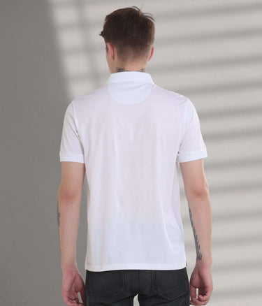 Back view of a white stain-proof polo t-shirt, showcasing its tailored fit and premium cotton blend for everyday wear.