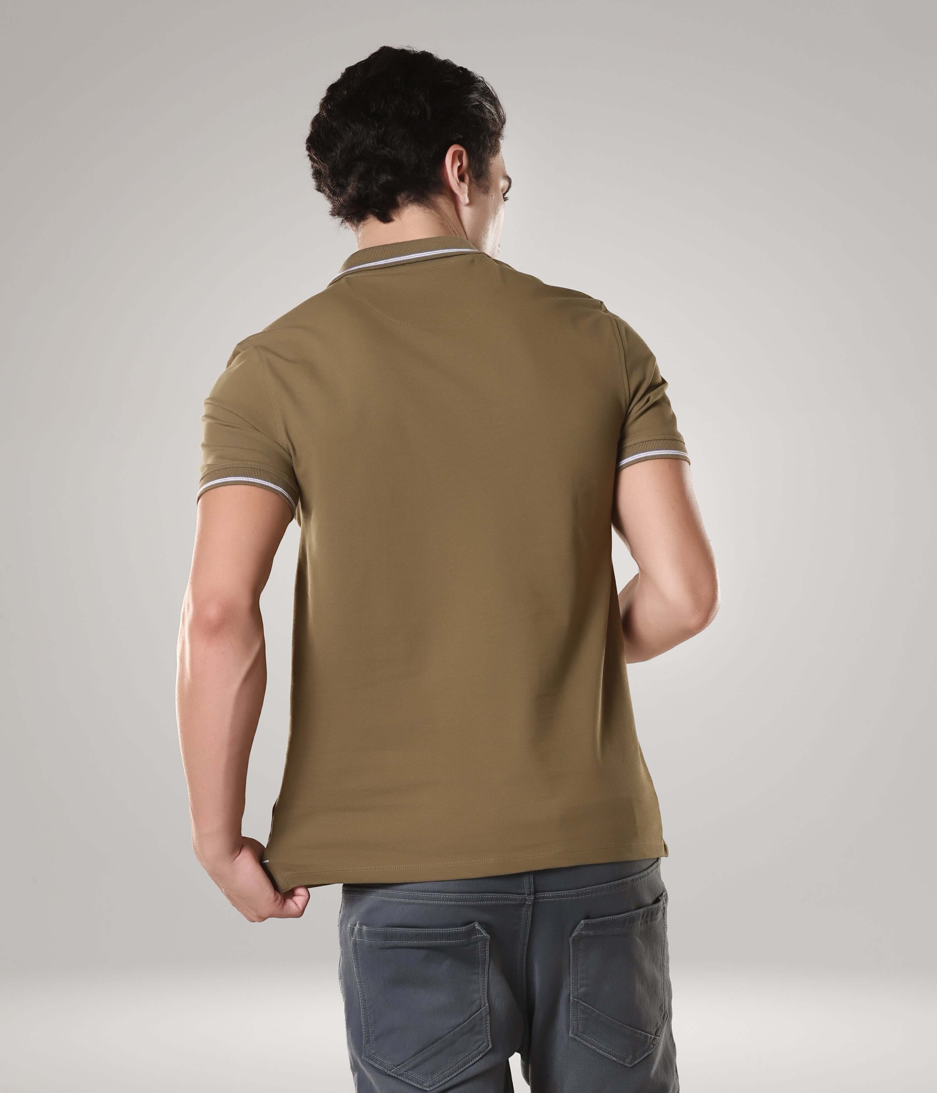 Man wearing Turms intelligent apparel Tranquil Green polo t-shirt, anti-stain, anti-odor, premium cotton blend, back view.