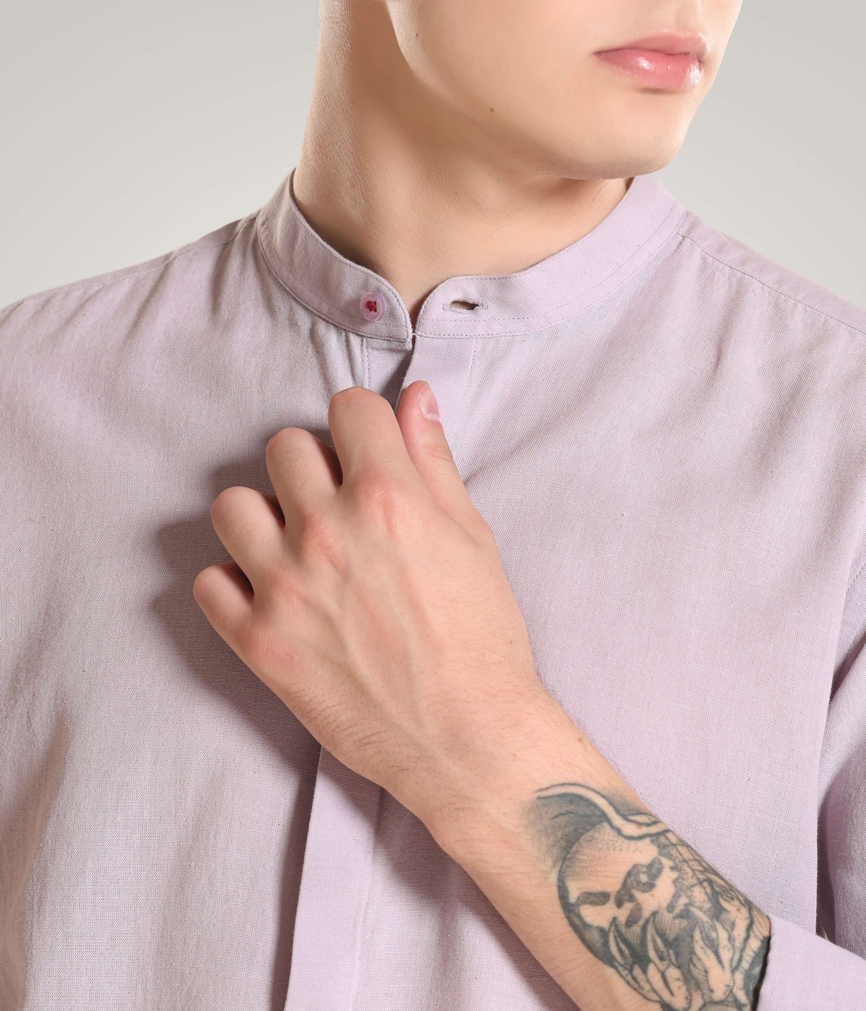 Close-up of a man wearing a premium cotton-linen blend shirt with mandarin collar, showcasing meticulous stitching and style, Turms intelligent apparel.