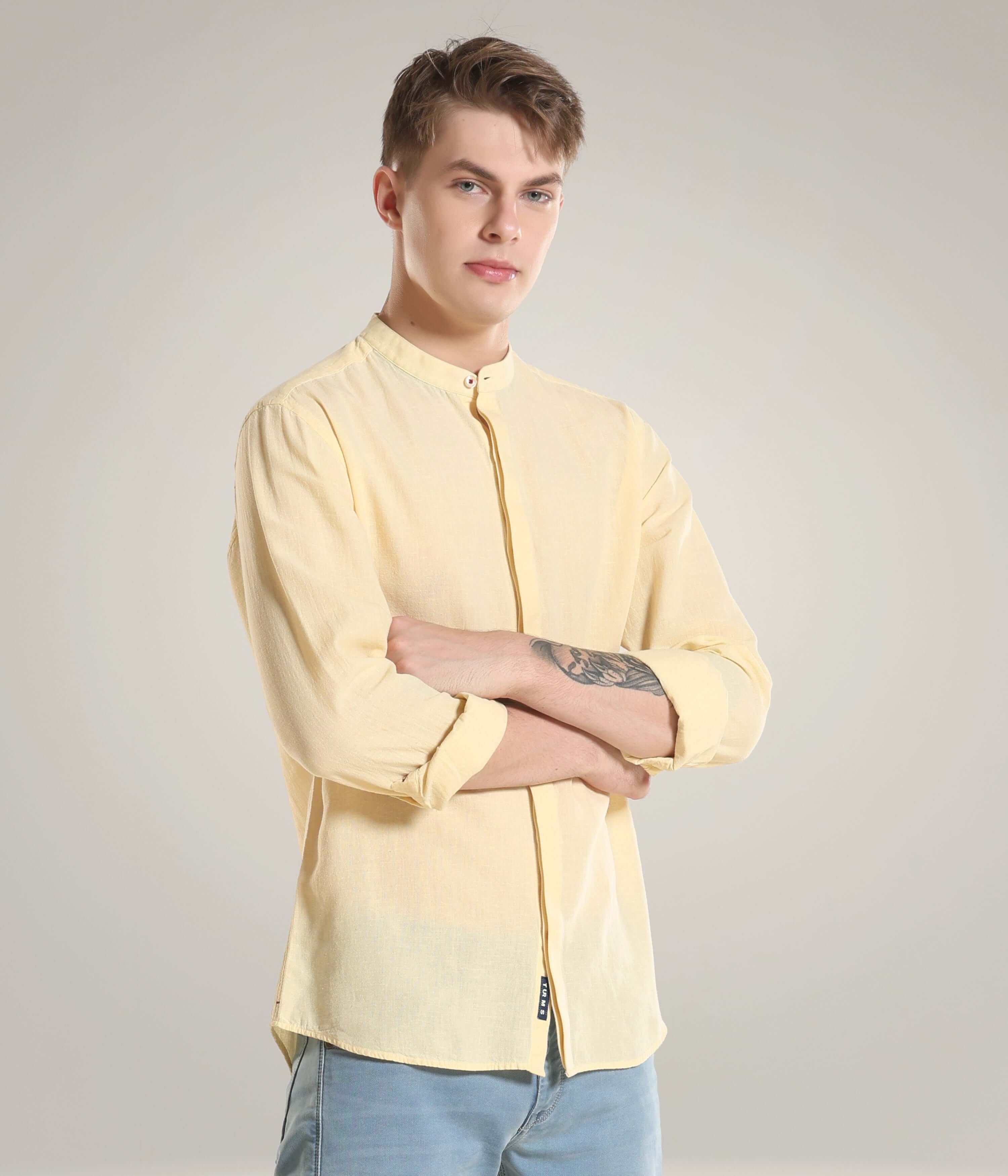 Pastel yellow cotton-linen Turms shirt with mandarin collar showcasing premium intelligent apparel with CoolTech, anti-stain, and anti-odor features.