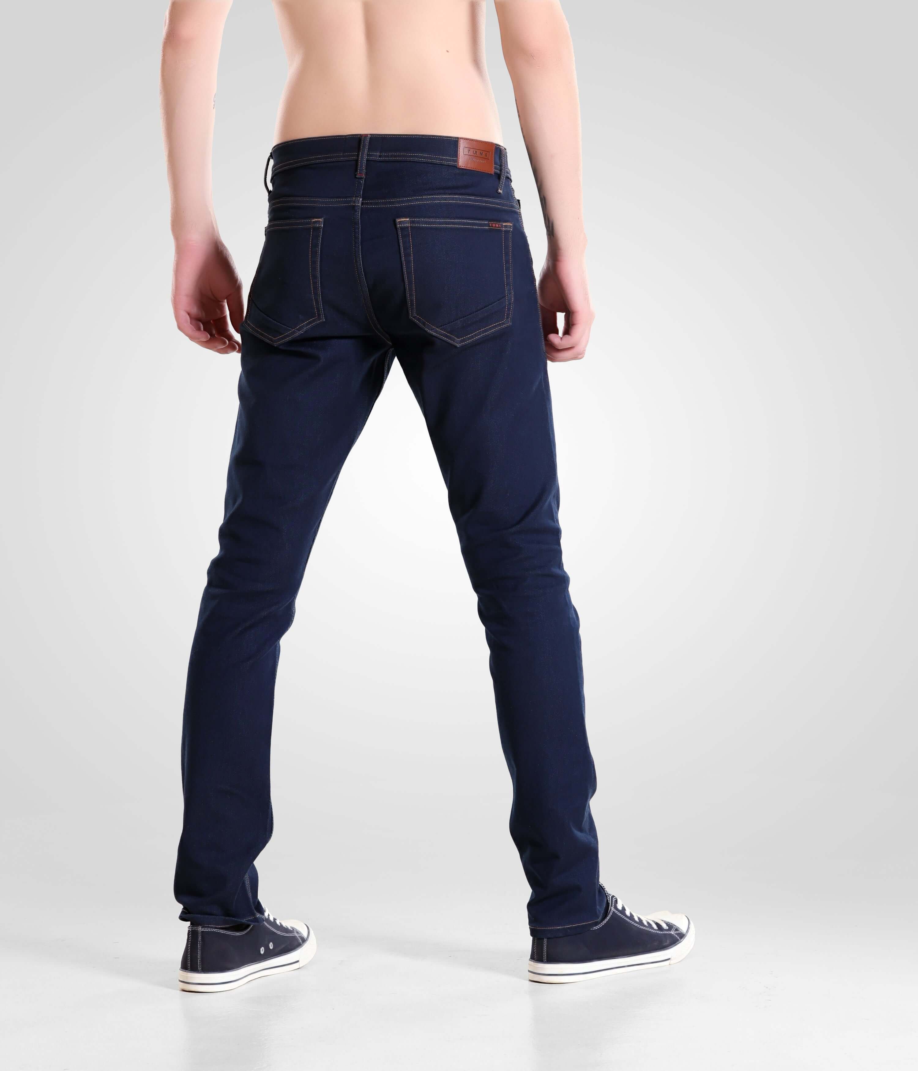 Indigo Trotter high-performance denim pants for men in dark blue, back view showcasing stylish design by Turms Intelligent Apparel