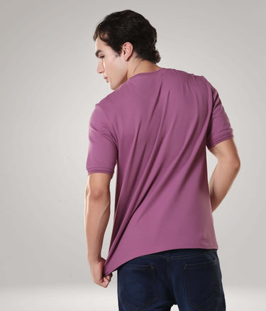 Man wearing Dusty Rose Turms T-shirt made of premium cotton, featuring CoolTech and anti-microbial properties, showcasing tailored fit and round-neck design.