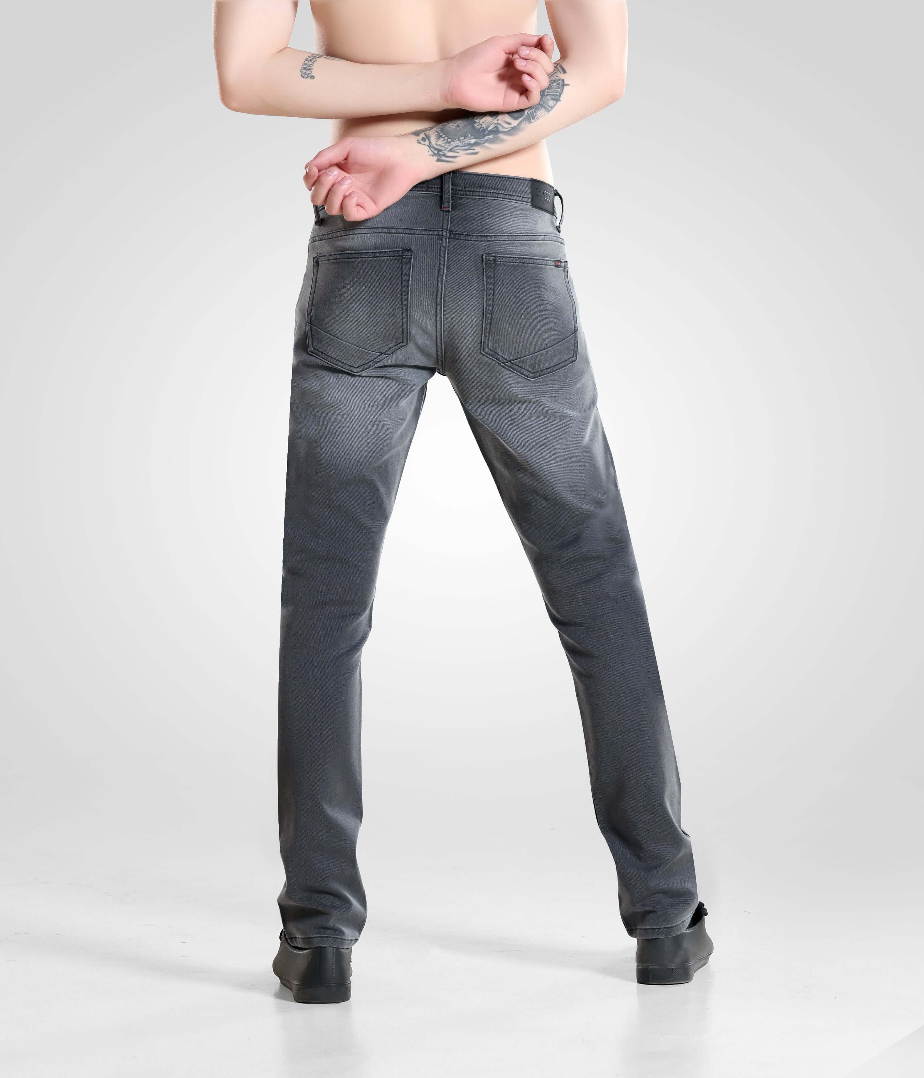 Grey Monk high-performance denim pants for men by Turms Intelligent Apparel, back view showcasing premium menswear fashion and comfort.