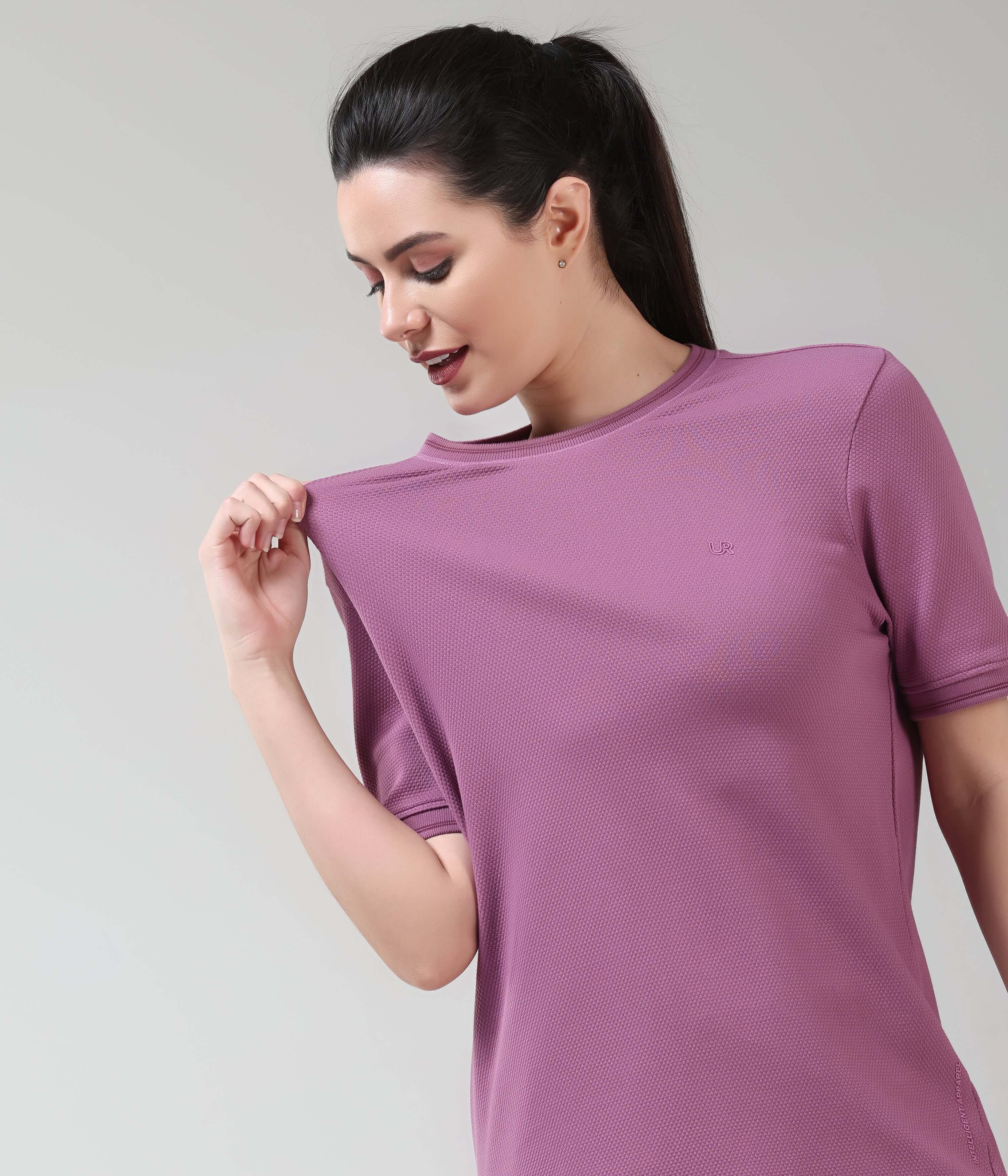 Woman wearing Dusty Rose COOLTECH T-shirt by Turms Intelligent Apparel, featuring anti-odour honeycomb fabric in new colour.