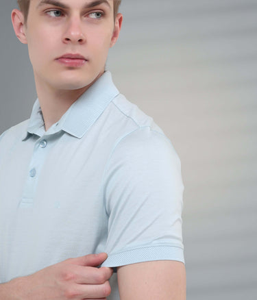 Tailored fit light blue polo t-shirt showcasing stain-proof and anti-odor features for modern menswear.