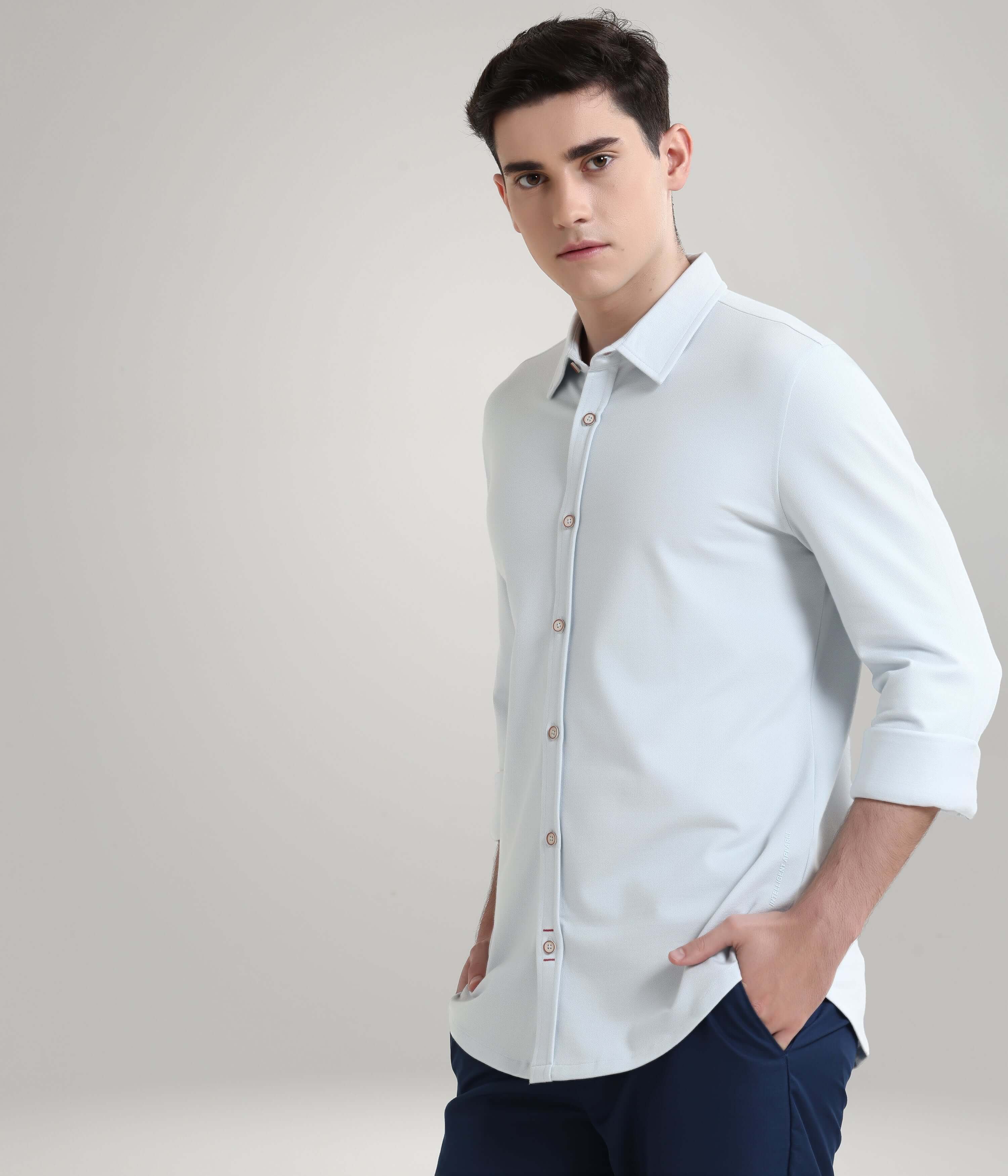 Man wearing Ethereal Blue knitted Turms shirt, showcasing premium menswear with anti-stain and anti-odor features.