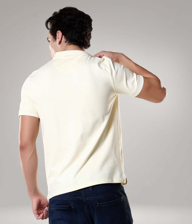 Back view of man wearing ivory Turms Polo T-shirt with tailored fit, anti-stain, anti-odor, and anti-microbial features made from premium cotton and Lycra.