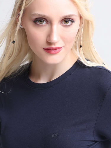 Woman wearing Blue Mist stain-proof round-neck Turms T-shirt with tailored fit, made from premium cotton and spandex blend for best comfort.