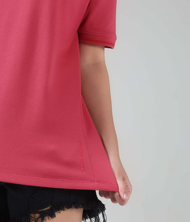Close-up of person wearing Regal Pink Turms COOLTECH T-shirt with honeycomb fabric, anti-odour, anti-microbial properties. New colour by Intelligent Apparel.