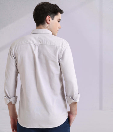 Back view of a man wearing a Pepple Haze Oxford Turms shirt, showcasing premium design and intelligent apparel features.
