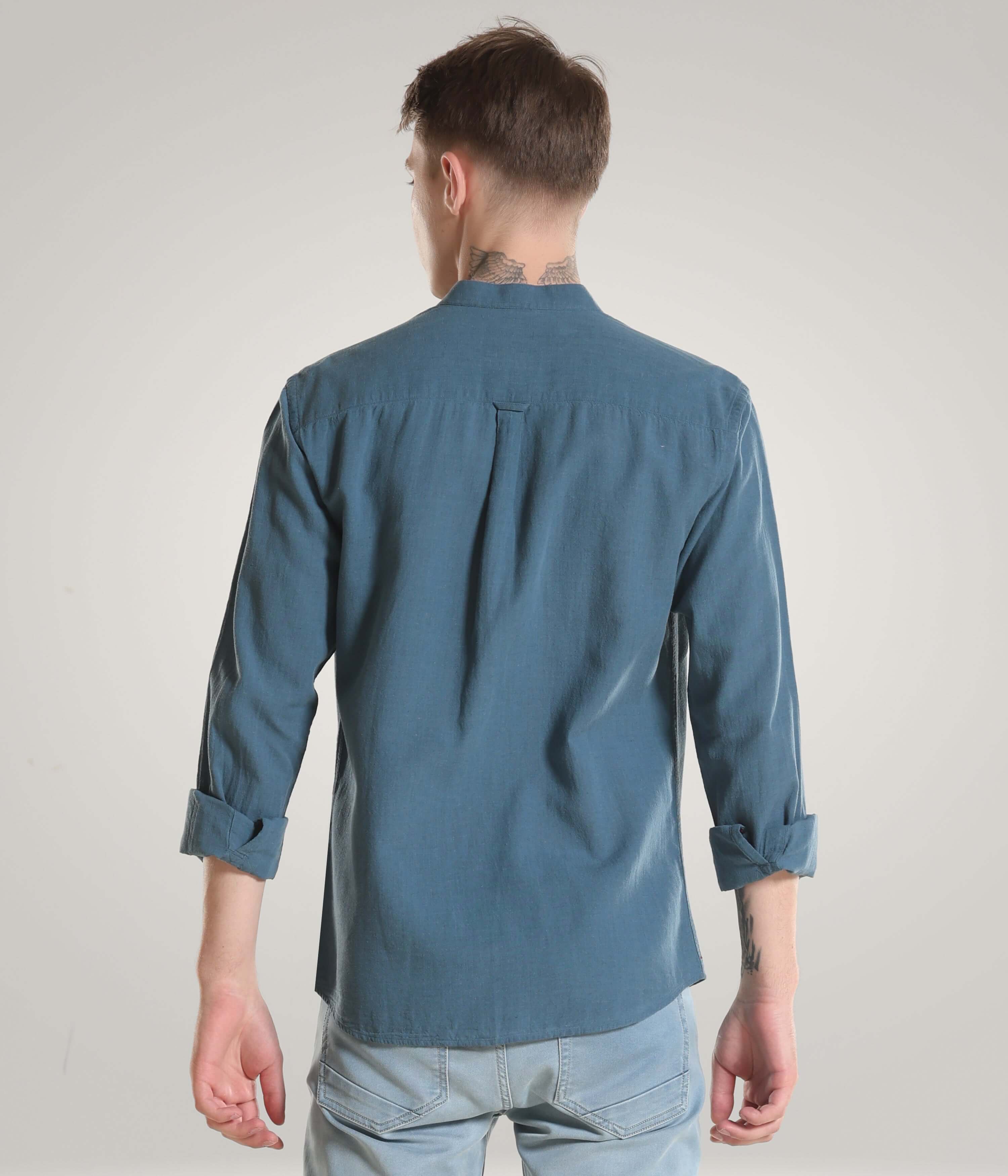 Man wearing Onyx Teal Turms shirt made from premium cotton and linen blend with Cooltech, anti-stain, and anti-odour features