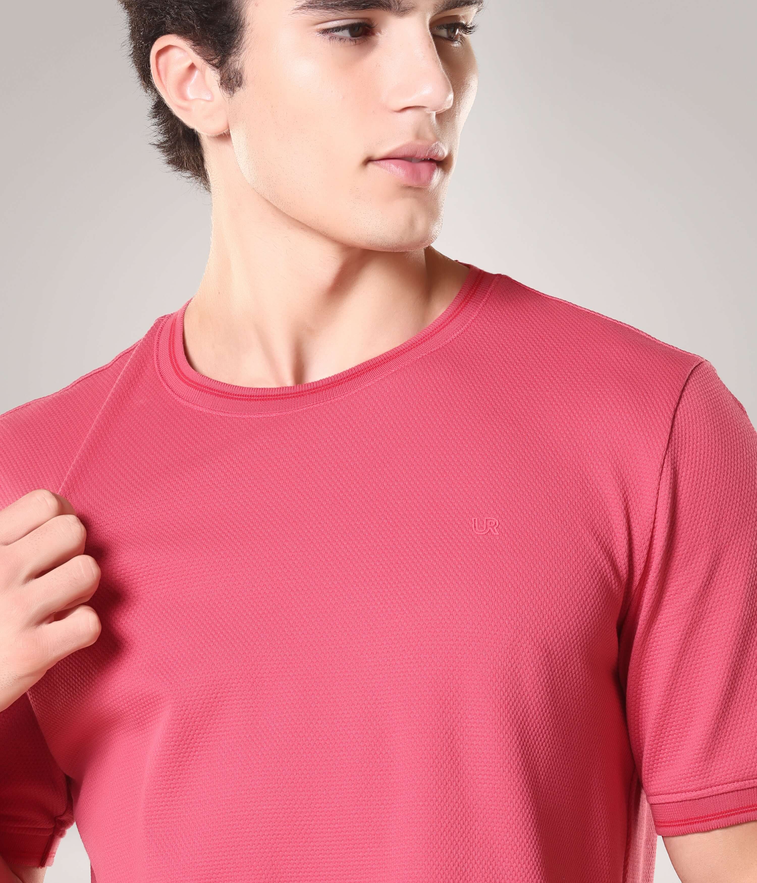 Man wearing Regal Pink Turms T-shirt with round neck, made from 95% premium cotton and 5% spandex, showcasing Cooltech anti-stain and anti-odor features.