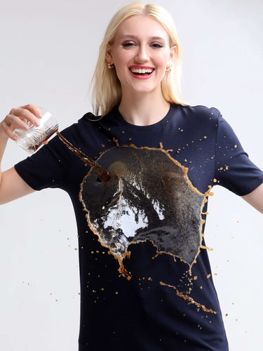 Woman wearing a stain-proof and odor-resistant round-neck Turms T-shirt while spilling drink, demonstrating stain-repellent quality