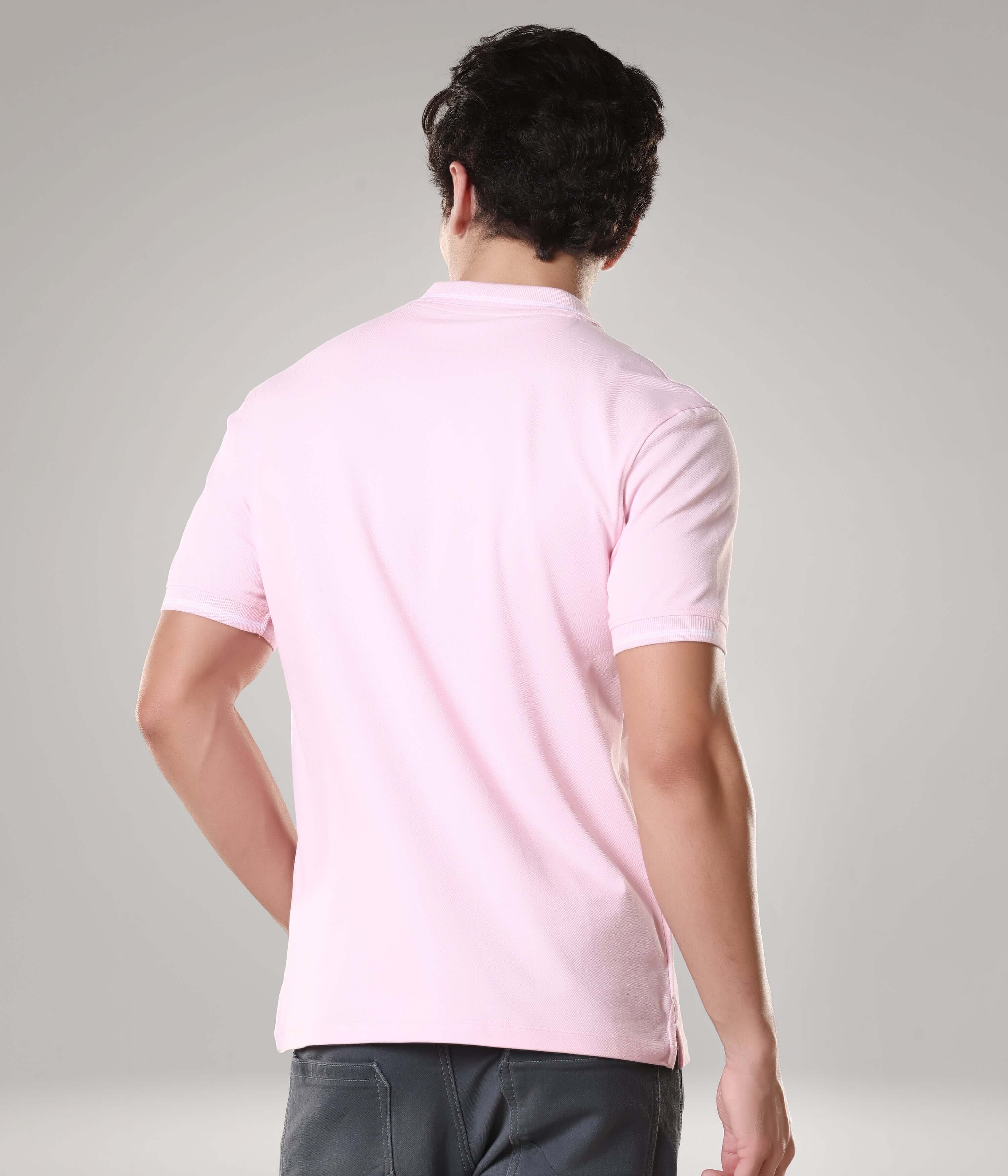 Back view of a man wearing a pink Turms Polo T-shirt, made of premium cotton and spandex, featuring anti-stain and anti-odor technology.