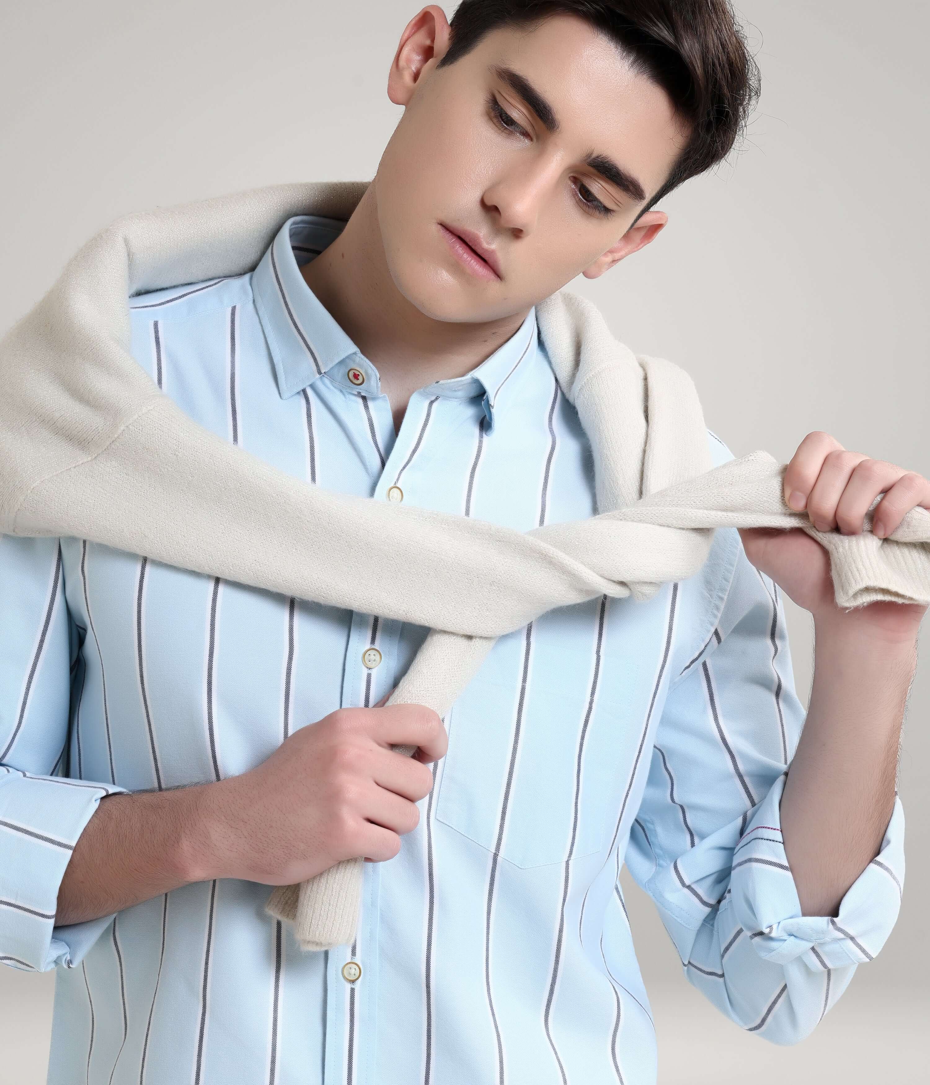 Man wearing Monochrome Blue striped Oxford Turms shirt, premium menswear, featuring anti-stain, anti-odour knit for everyday luxury.