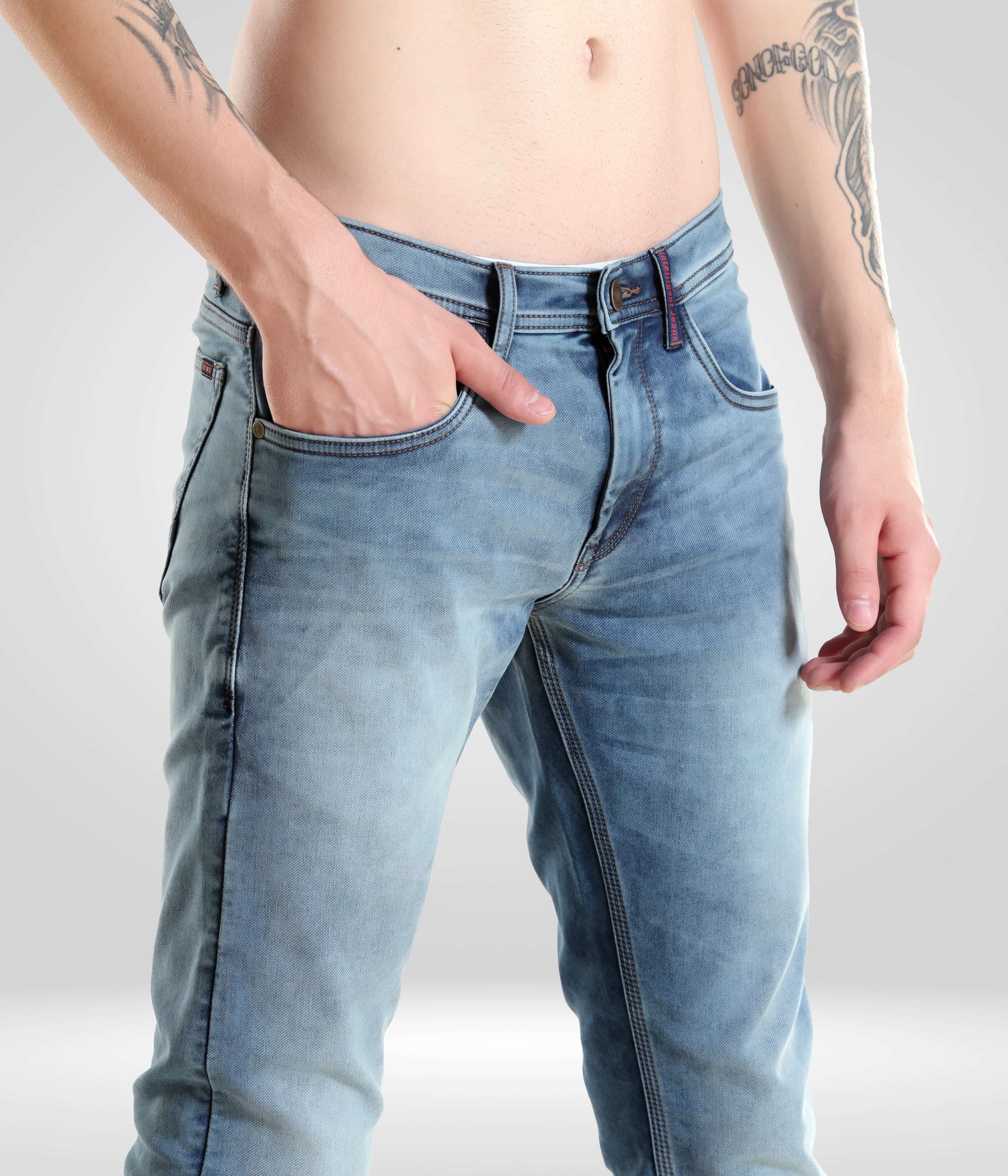 Close-up of a man wearing Blue Birdy high-performance denim pants from Turms Intelligent Apparel, showcasing premium light blue menswear design.