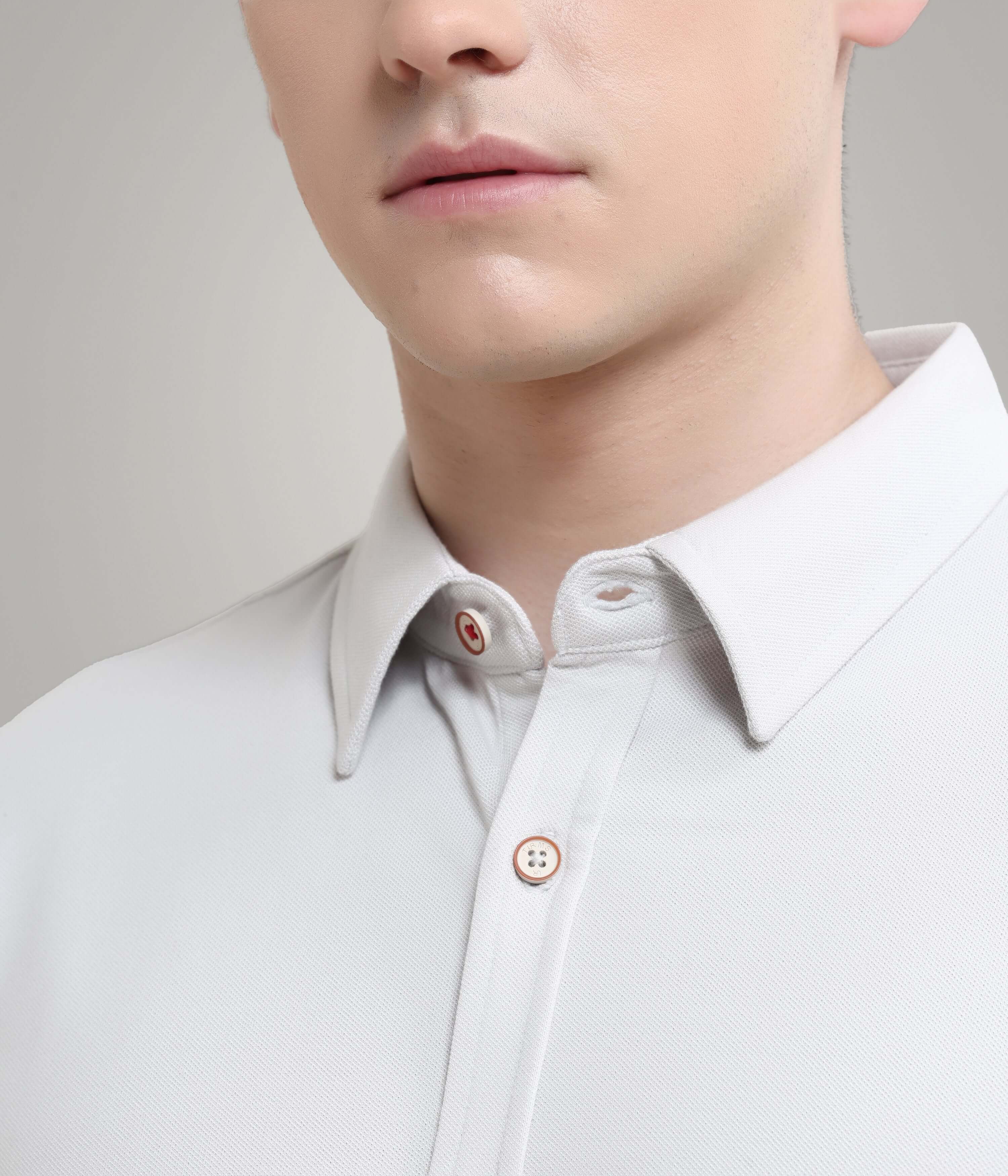 Close-up of Ashen Grey knitted shirt showcasing premium menswear design with anti-stain and anti-odour features.